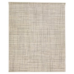 Tappeto in lana beige e grigio astratto fatto a mano dalla texture moderna
