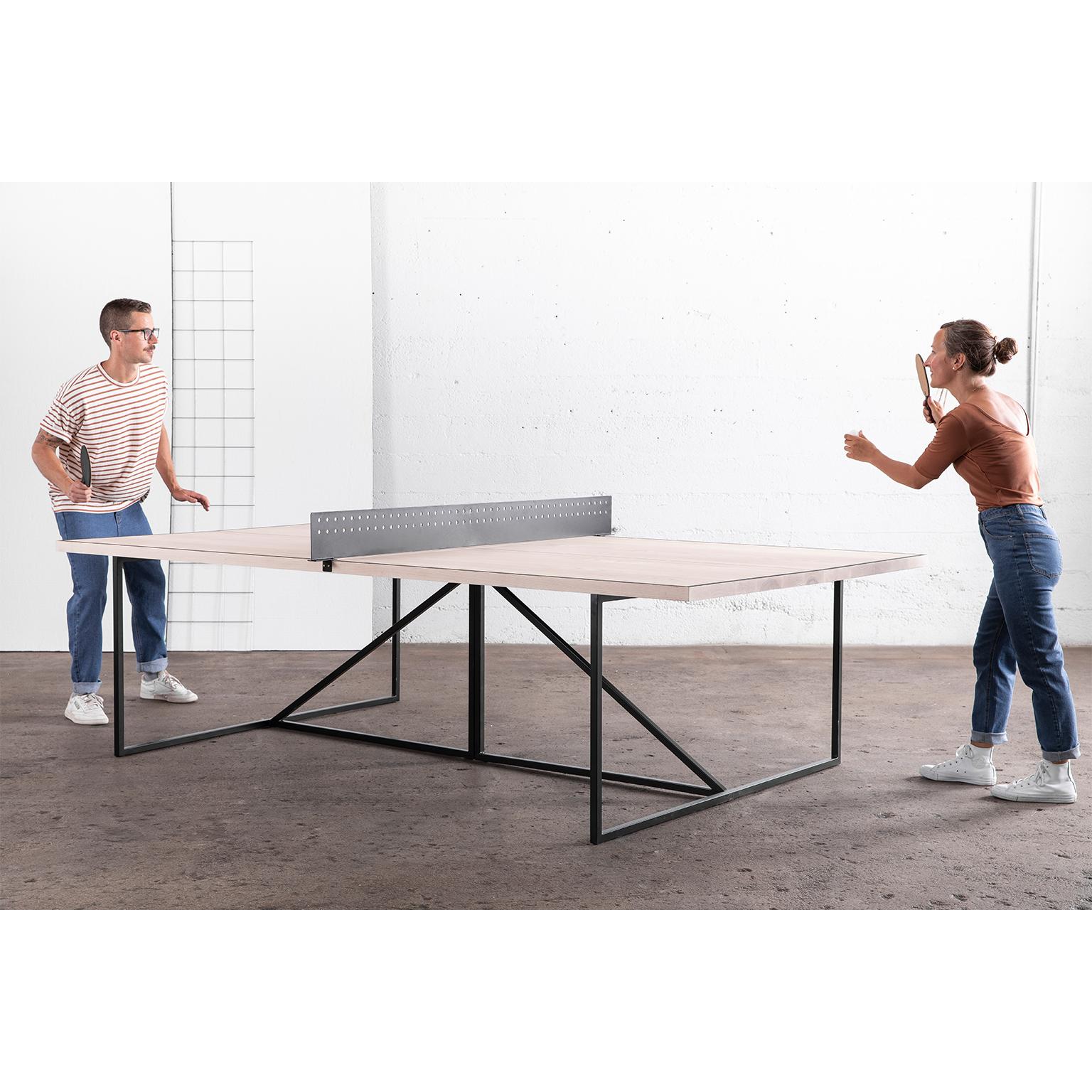 The Break Ping Pong Table gives a modern look to the classic parlour game.

The frame of the table is hand-welded from durable steel and can be finished in one of our three metal options. The table is divided by a regulation-sized metal net that’s