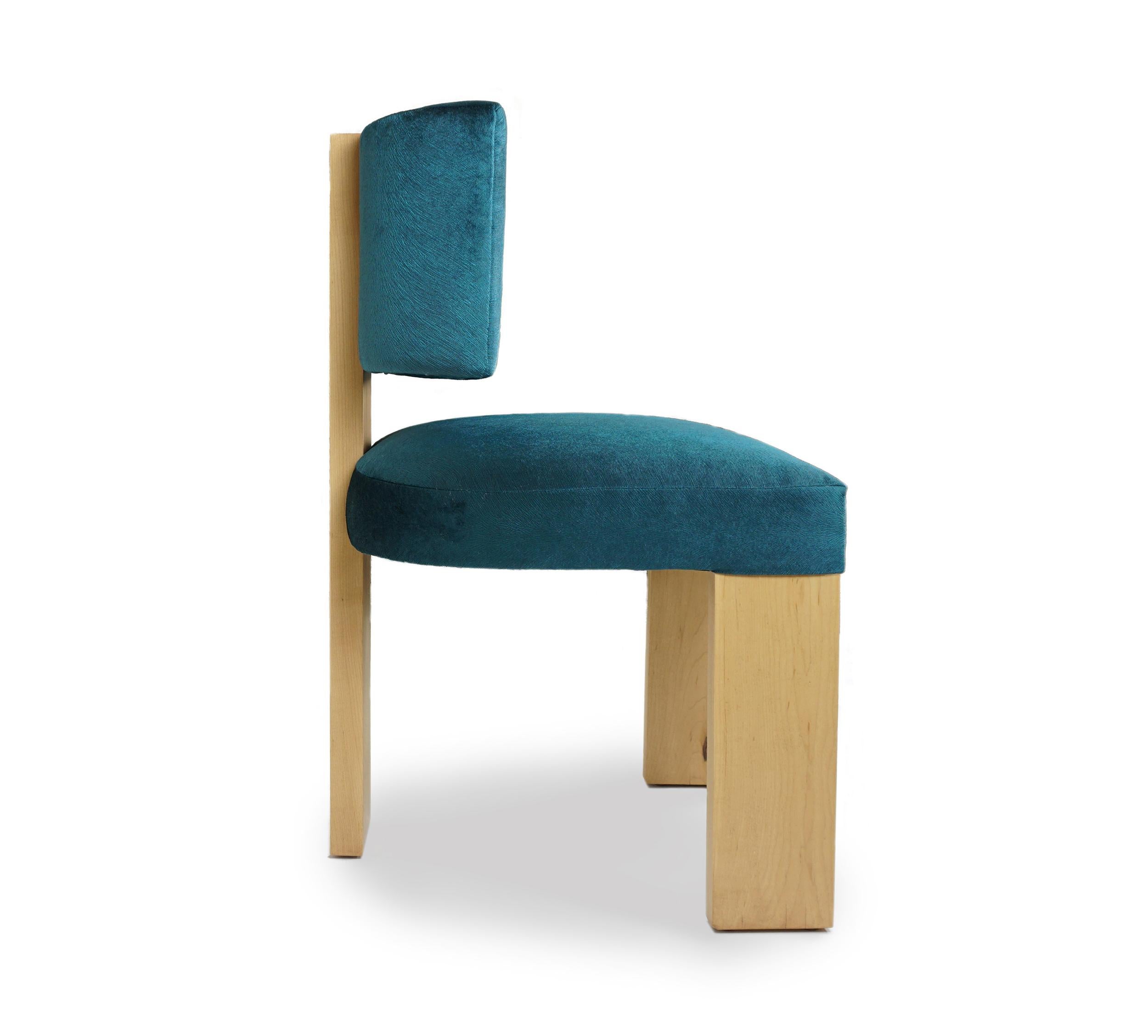 About this piece
This customizable dining chair is made with a solid hard maple frame. From the back the piece has a striking visual impact and its also surprisingly comfortable, cradling the back just below the shoulder blades and offering ample