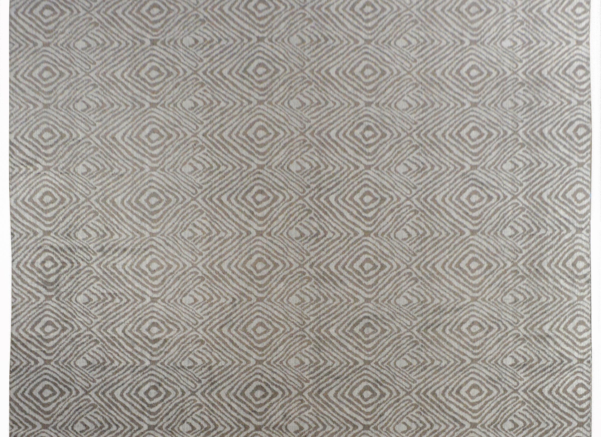 A super cool contemporary Indian rug with a mesmerizing thumbprint pattern woven in contrasting shades of gray, and without a border.