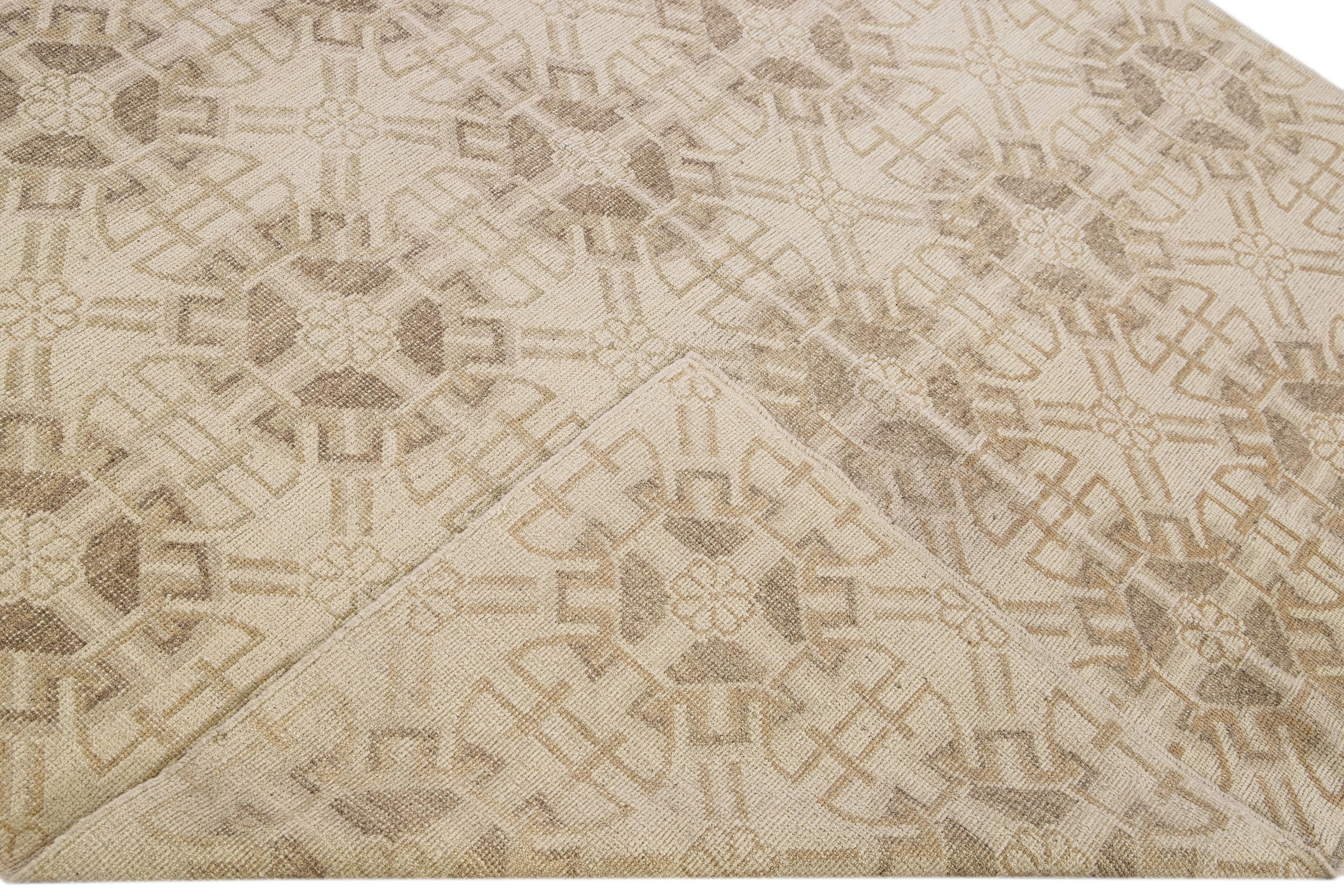 Beautiful modern Tibetan hand-knotted wool rug with a beige field. This Tibetan rug has brown accents in a gorgeous all-over geometric pattern design.

This rug measures 6'1