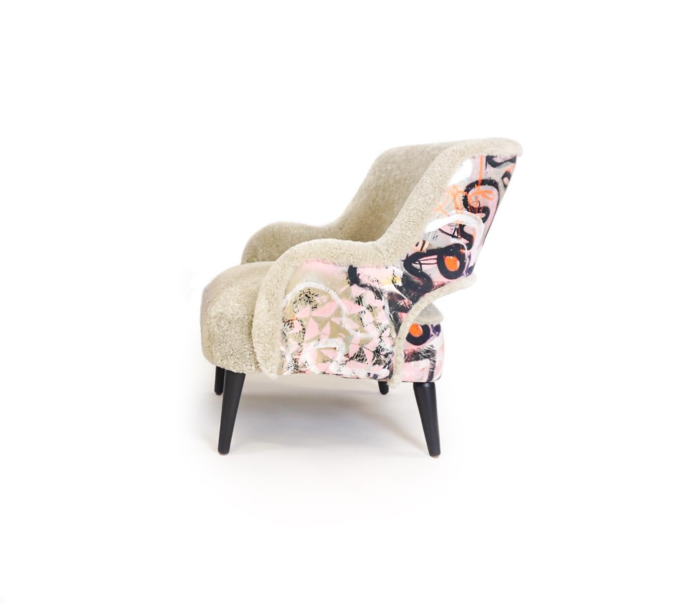 About this piece
Price is per one chair in fabric shown. This customizable club chair features an open back, tight seat and back cushions and matte lacquered round turned legs. The ottoman is sold separately. Our upholstered frames are built with