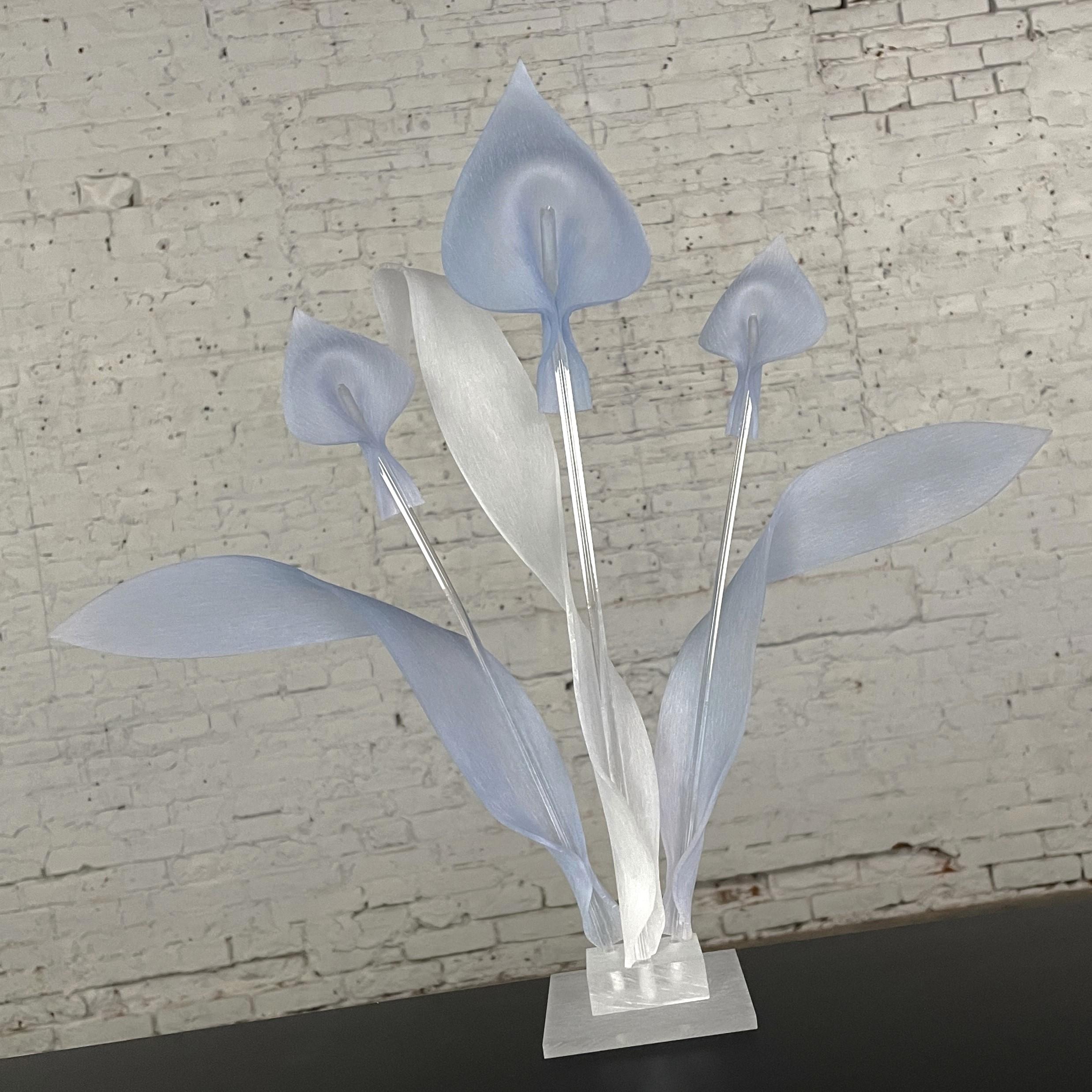 Beautiful vintage Modern to Postmodern calla lily sculpture or centerpiece comprised of light blue frosted Lucite blooms and leaves, frosted Lucite base & leaf, and clear Lucite stems. Beautiful condition, keeping in mind that this is vintage and