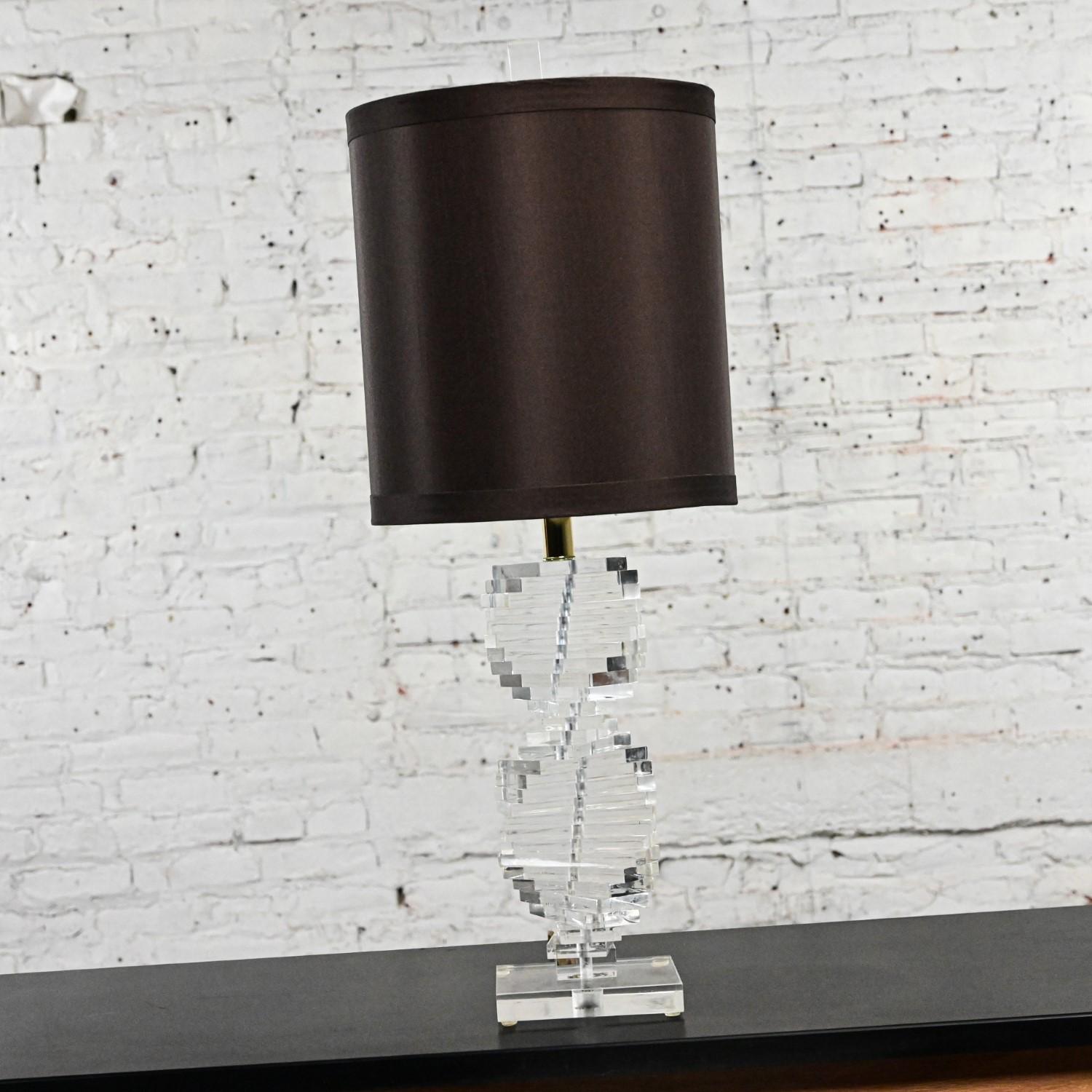 Fabulous Modern to Postmodern Helix spiral stacked Lucite table lamp by Bauer Co. Inc. with a new tall narrow espresso fabric hardback lined drum shade. Beautiful condition, keeping in mind that this is vintage and not new so will have signs of use