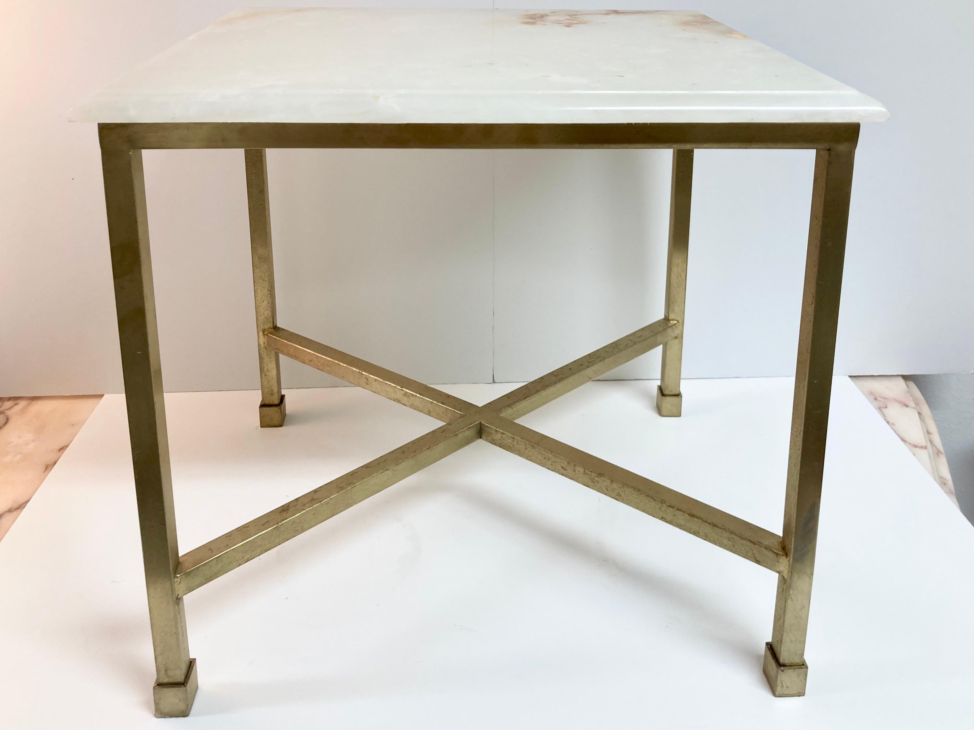 Single Todd Hase designed Christelle cocktail table with bianco onyx top and bronze base. This is a gallery sample from the 2010s. Typical gallery condition. We have 2 available, see additional listing. They would be a great pair as a coffee table