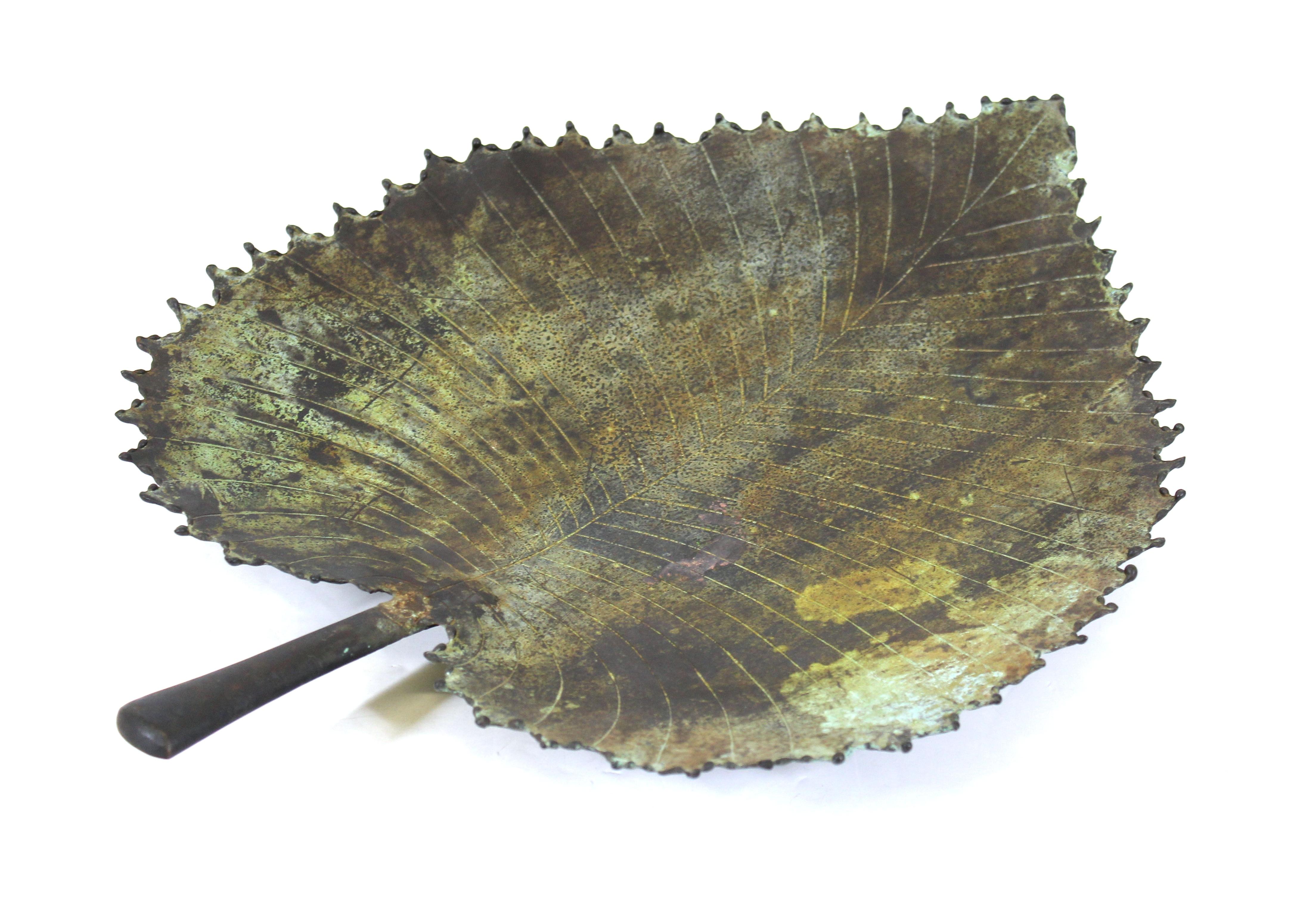 Modern Brutalist style torch cut metal leaf tray.