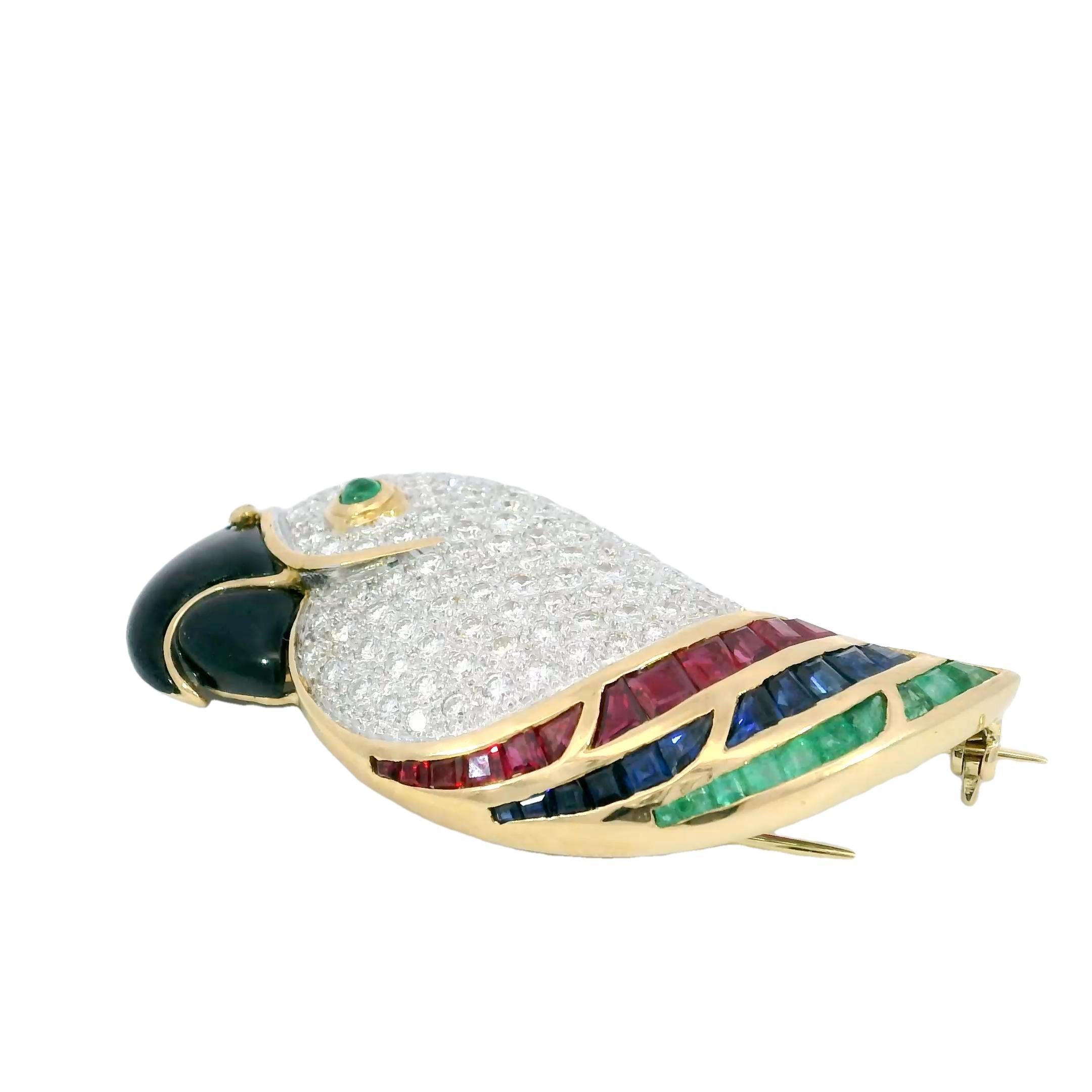 Picchiotti Parrot Bird Brooch 18K Yellow Gold with Emerald Rubies Sapphires

This exceptional 18K yellow gold toucan brooch captures the beauty and vibrancy of nature with remarkable artistry. Designed with meticulous attention to detail, the bird’s
