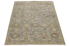 Tappeto di transizione moderno e geometrico in lana - motivo annodato a mano blu e beige