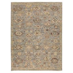 Tappeto di transizione moderno e geometrico in lana - motivo annodato a mano blu e beige