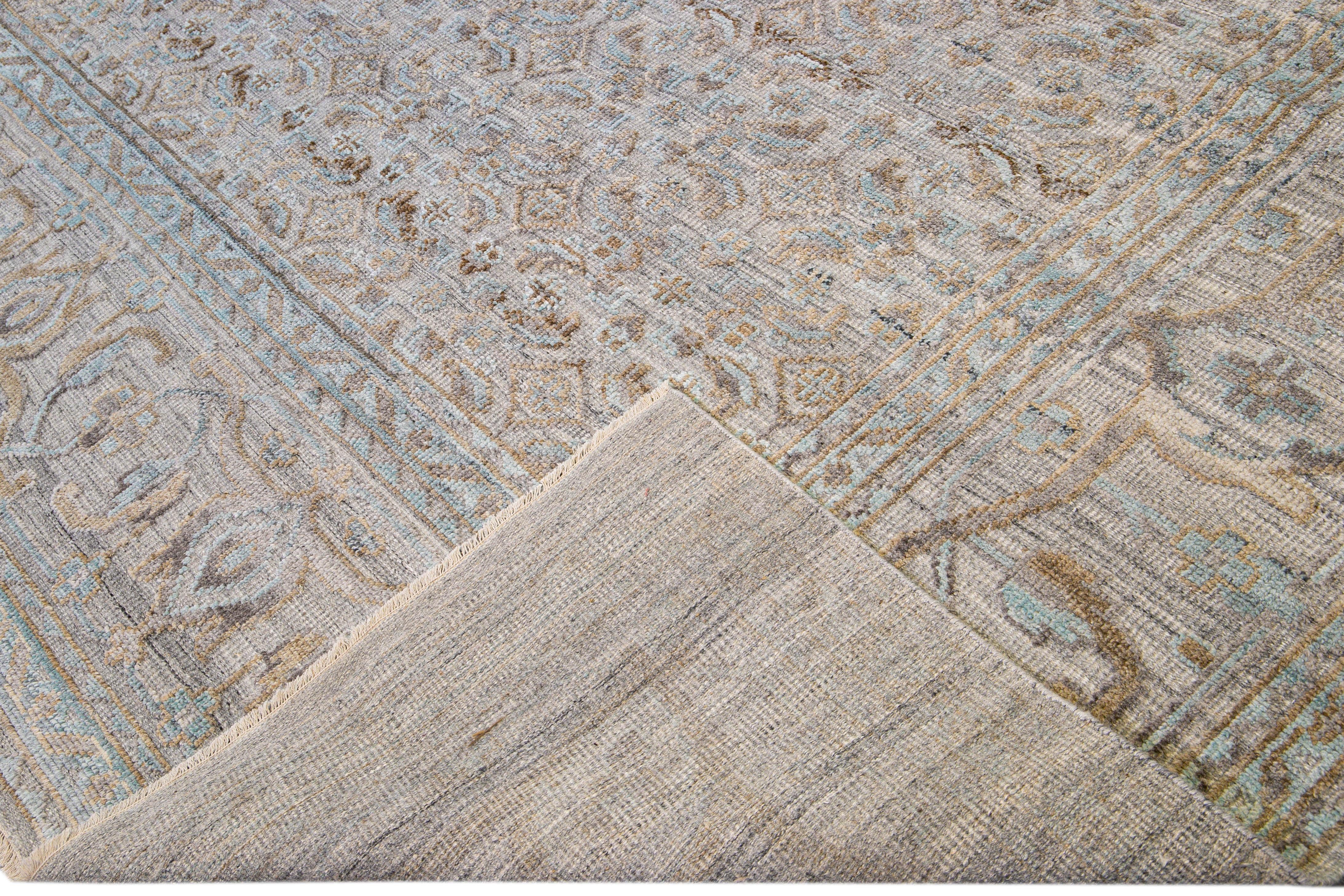 Beautiful modern hand-knotted wool rug with a beige field. This Transitional rug has blue, gray, and brown accents to create a modern all-over floral pattern design with a mid-century look. 

This rug measures: 11'10