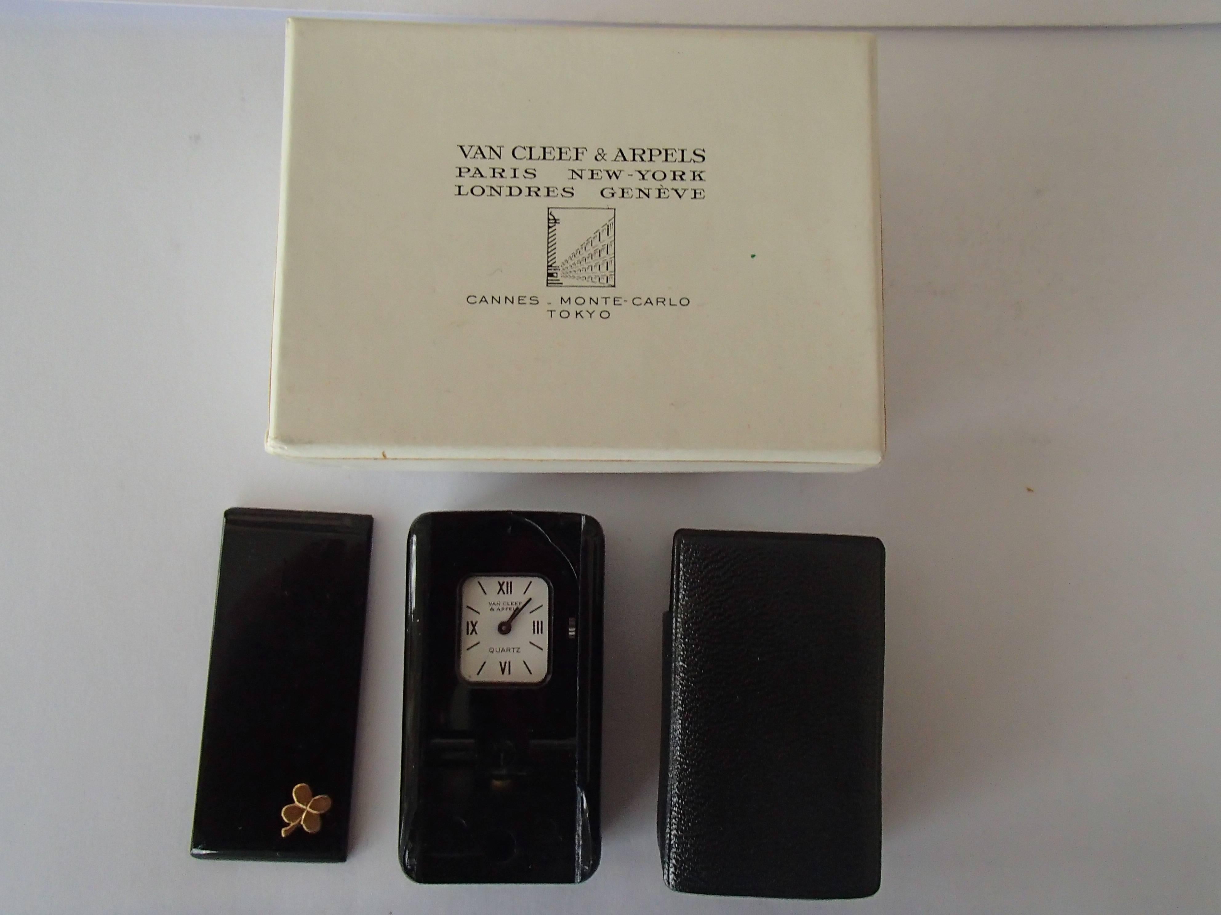 Modern travelling clock by Van Cleef & Arpels foldable in case and original box.
