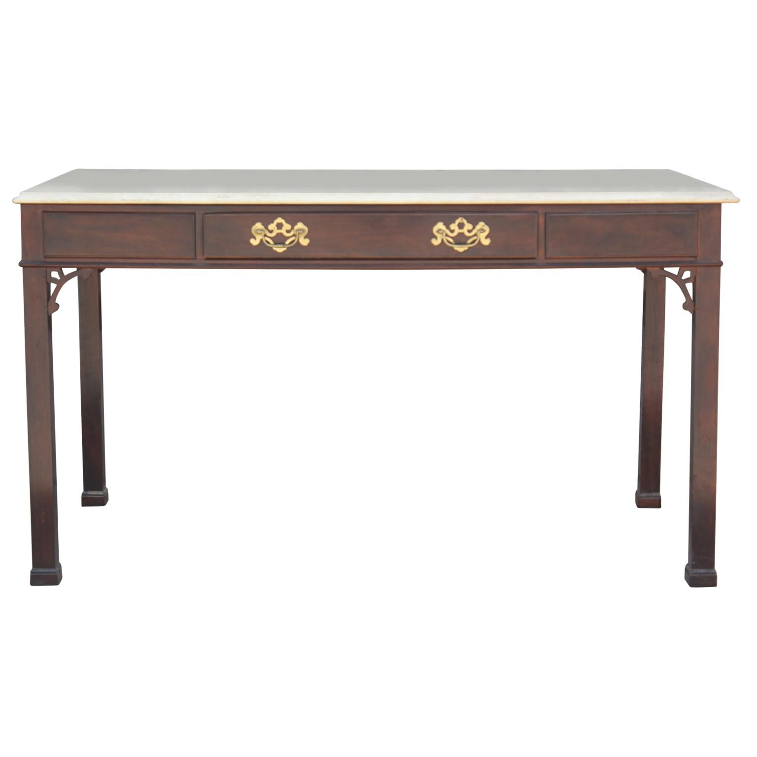 Modern Chinese Chippendale style desk with a travertine top by Henredon featuring a single drawer with brass hardware.