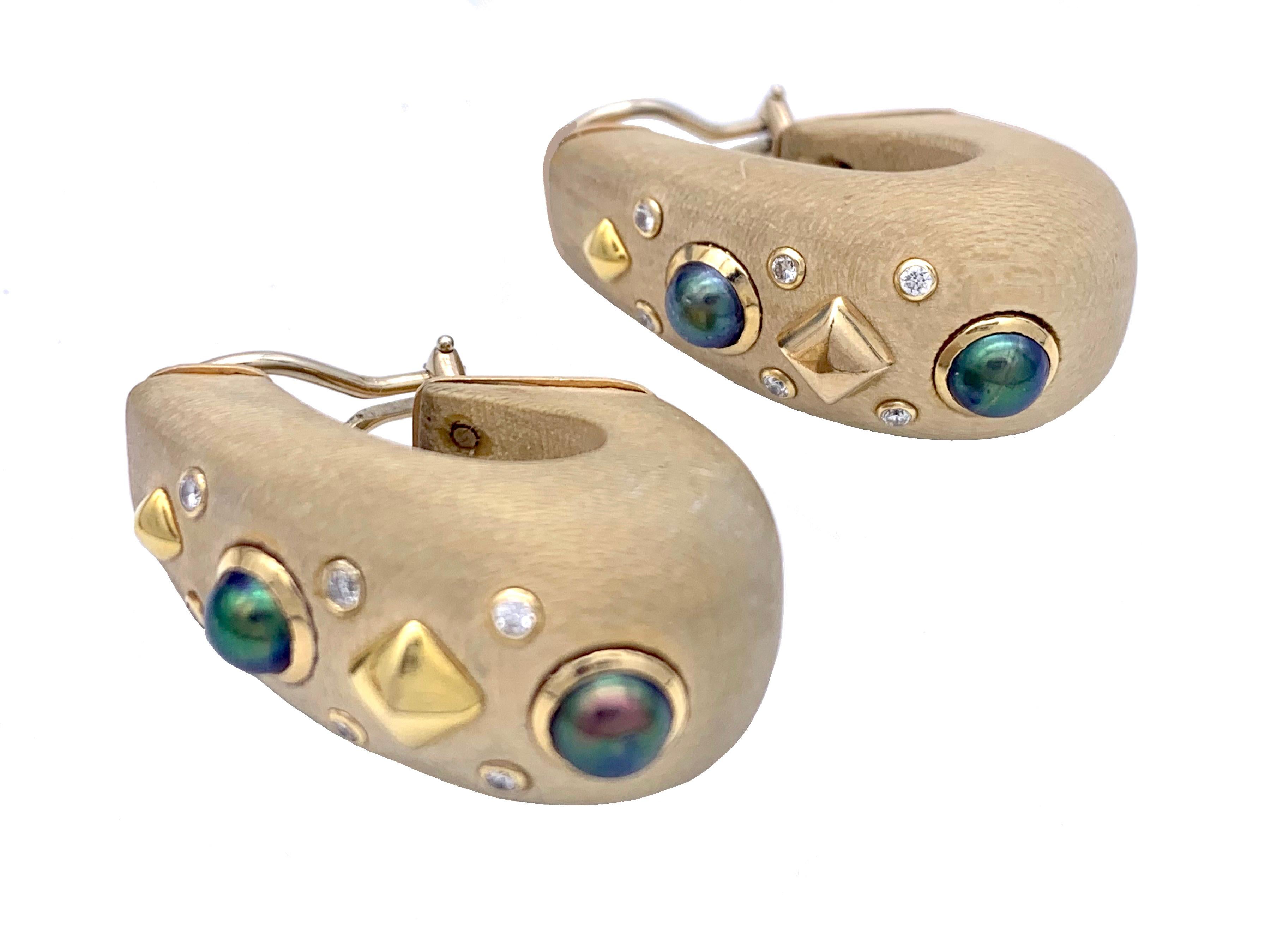 These stunning large clip on earrings fully signed Trianon ate marked 14 k. Golden Rivets in two different sizes, gold mounted greenish-grayish pearls and gold mounted diamonds make these clips an exciting accessory.   