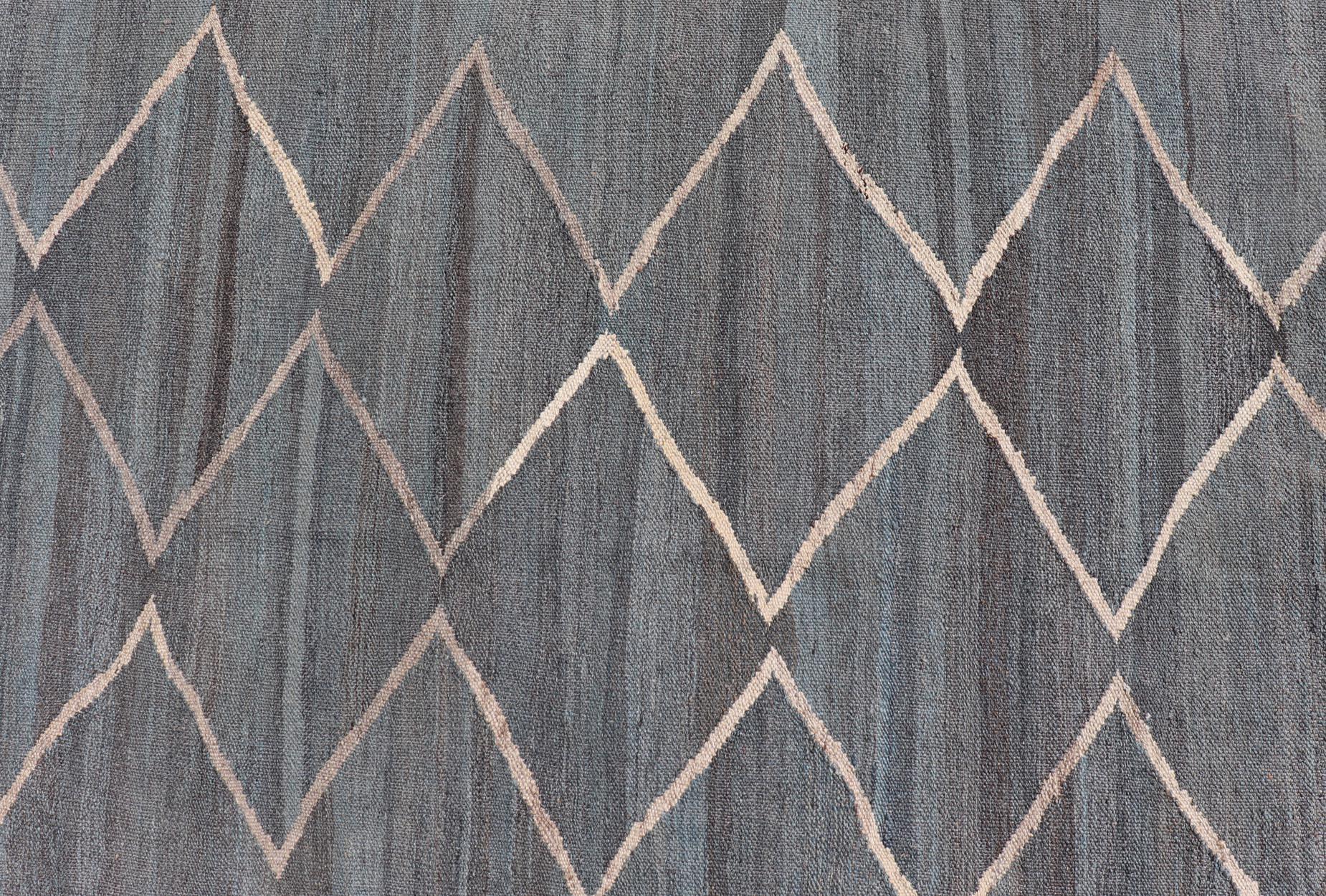 Measures: 8'6 x 11'4 
Modern Tribal Afghan Kilim Flat Weave in Charcoal-Blue and Ivory 8'6 x 11'4. 
Keivan Woven Arts / rug/AFG-040, country of origin / type: Afghan/ Kilim, circa 2010-. 

This Modern Tribal Afghan Kilim Flat Weave rug exemplifies