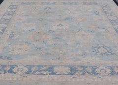 Modern Tribal Oushak with a Blue Border and Light Gray-Blue Background