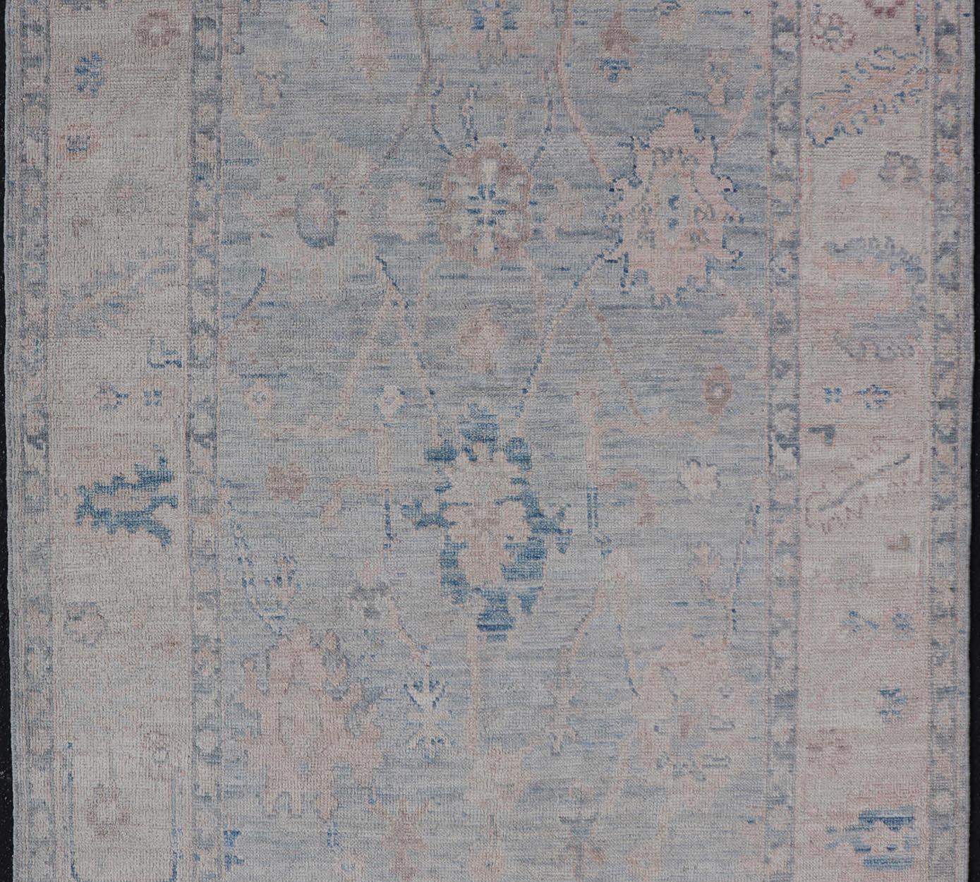 Afghan Modern Tribal Oushak with a Cream Border and Light Gray-Blue Background For Sale