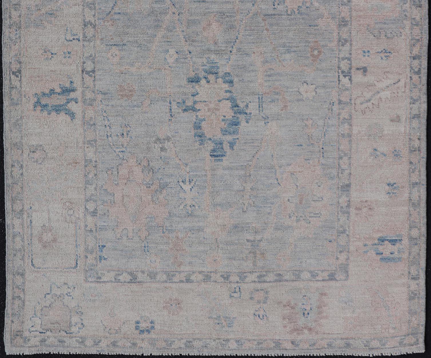 Hand-Knotted Modern Tribal Oushak with a Cream Border and Light Gray-Blue Background For Sale