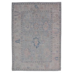 Modern Tribal Oushak with a Cream Border and Light Gray-Blue Background