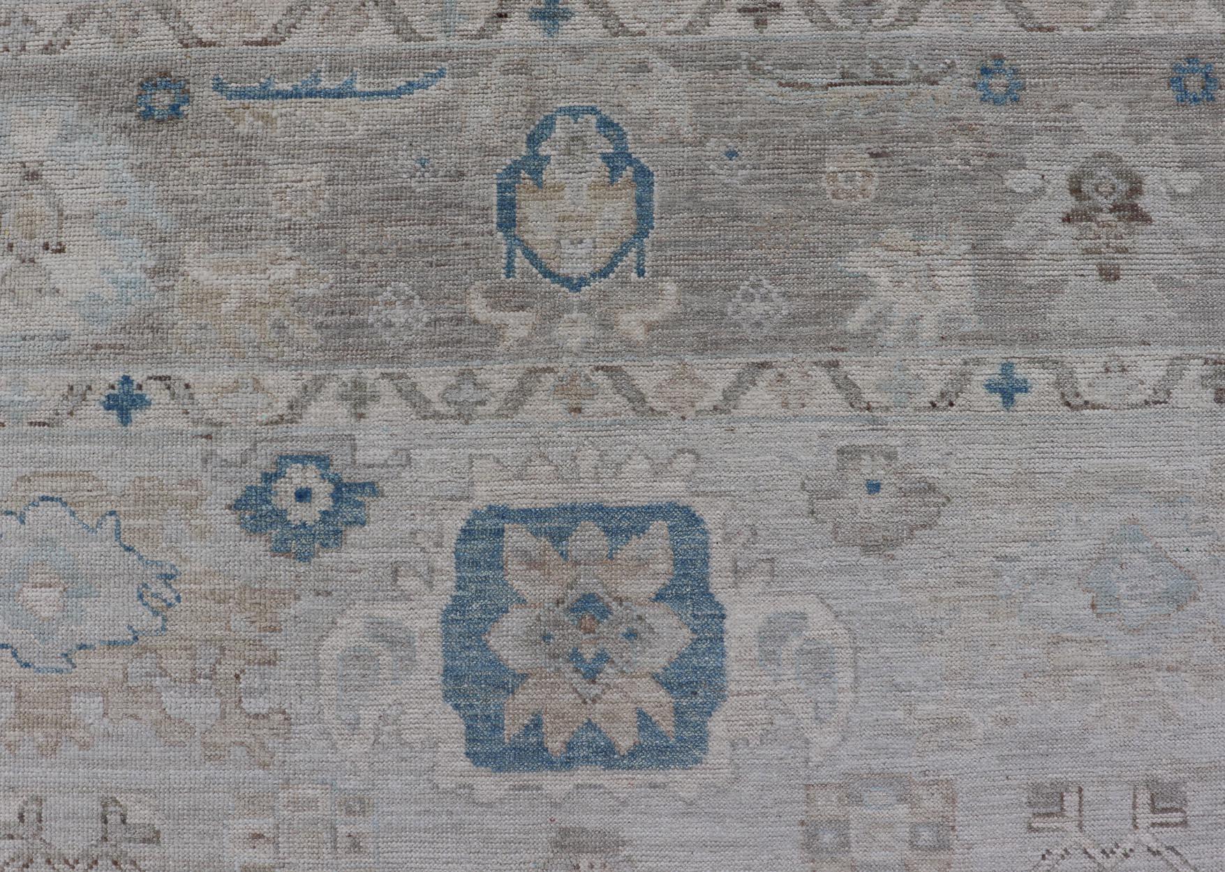 Wool Modern Tribal Oushak with Light Taupe Colored Border and Off White Background For Sale