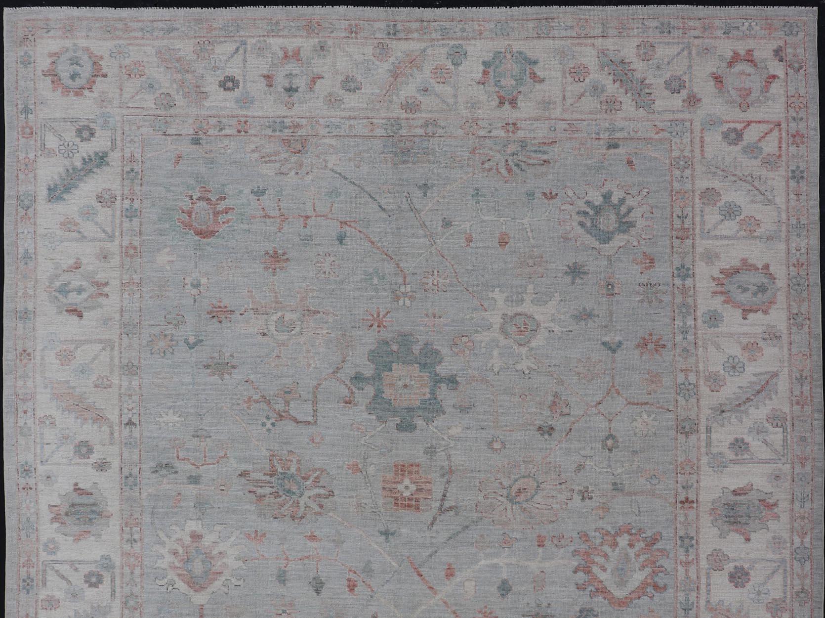 Modern Tribal oushak with muted background in wool with all-over design Keivan Woven Arts; rug AWR-9008 Country of origin: Afghanistan Type: Oushak Design: All-Over, Floral,

Measures: 8'11 x 11'9 

This hand-knotted Oushak has a very classic