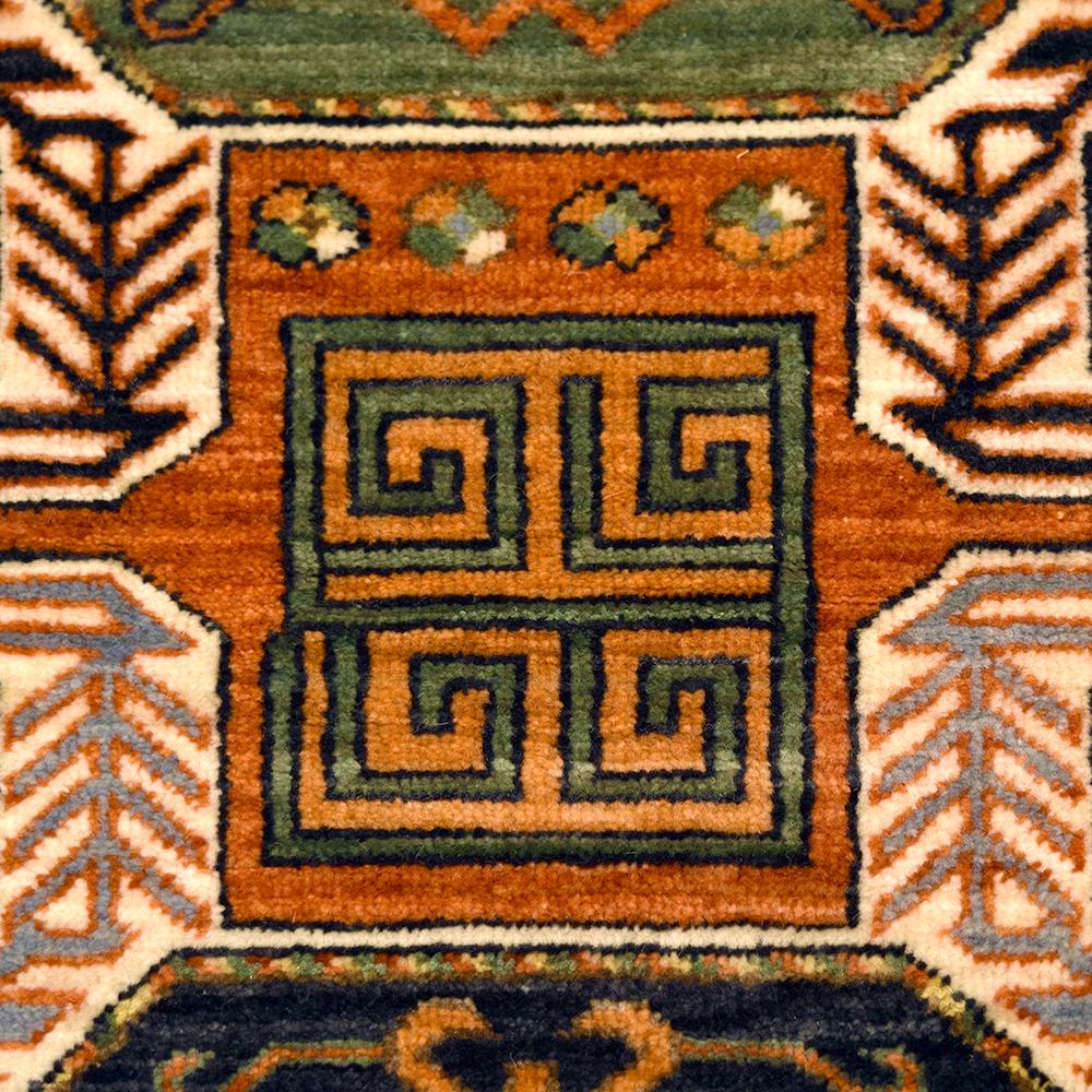 Measuring 3’ x 5’1”, this hand-knotted carpet inspired by traditional Caucasian designs belongs to Orley Shabahang’s Tribal Revival Collection. The vivid shades of orange, green, blue, indigo and light blue originate from organic vegetable dyes. The