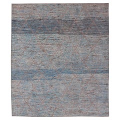 Alfombra tribal moderna de lana con diseño subgeométrico en azul, tostado y marfil