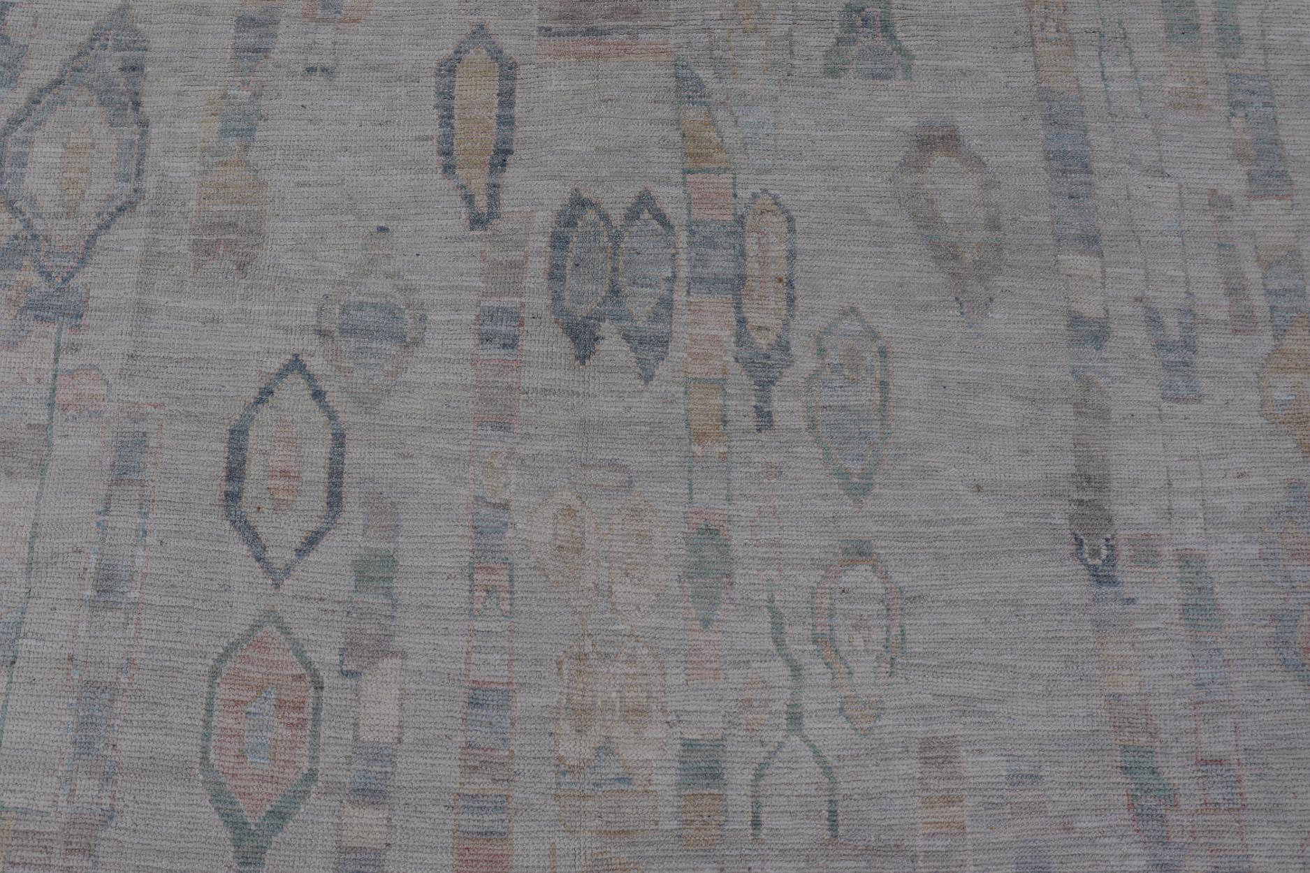 Measures: 9'0 x 11'11 
Modern Tribal Rug with Soft Gray and Pastel Geometric Patterns 9'0 x 11'11.
Keivan Woven Arts; rug AWR-236, country of origin / type: Afghanistan / Modern Casual, circa Early-21th Century.

This modern tribal rug features a