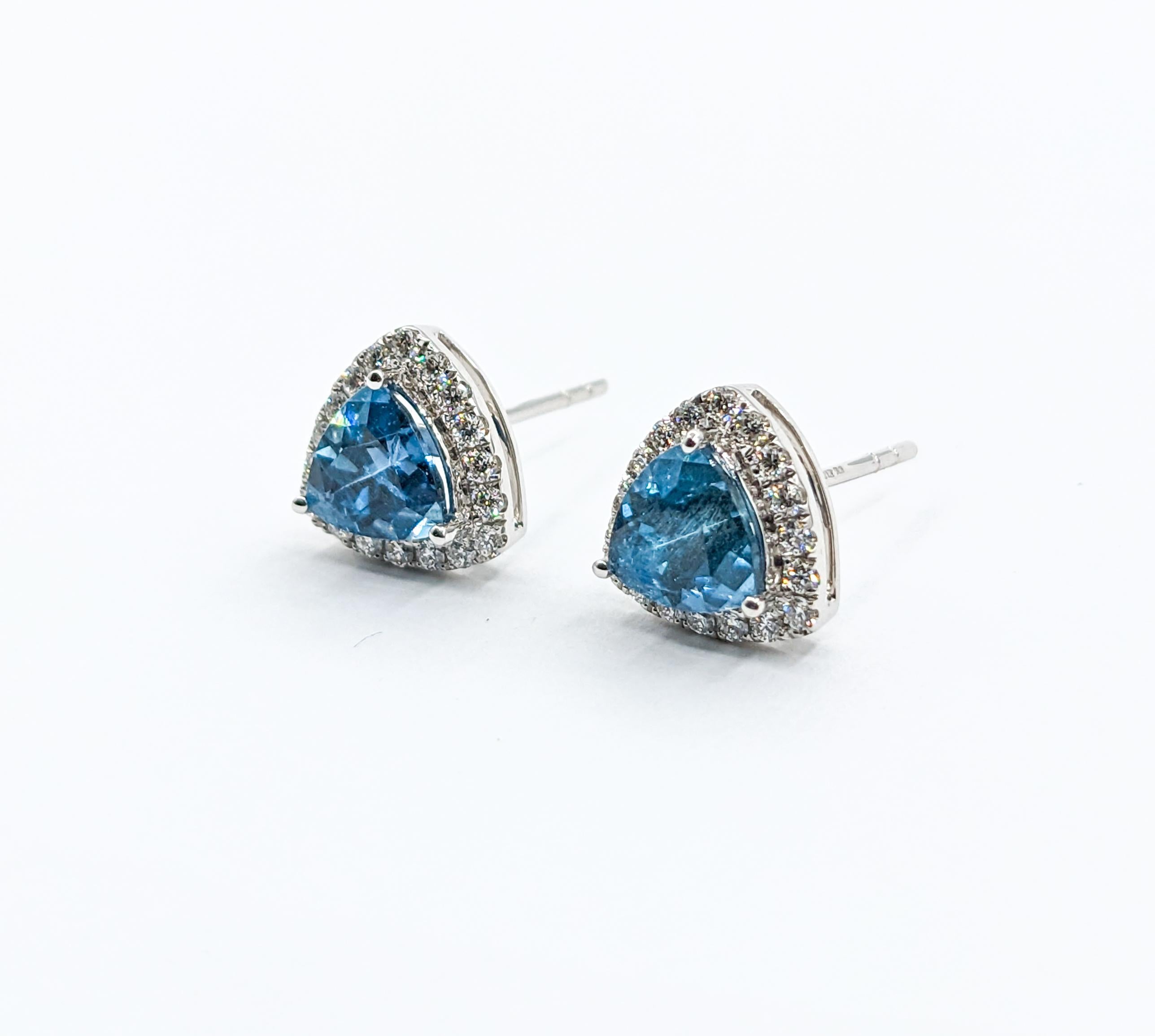 Modern Trillion Cut Aquamarine & Diamond Stud Earrings

Adorned with a mesmerizing array of sparkling round diamonds, totaling .32 carats, this piece emanates a captivating brilliance. The diamonds boast a remarkable SI1 clarity and a radiant G