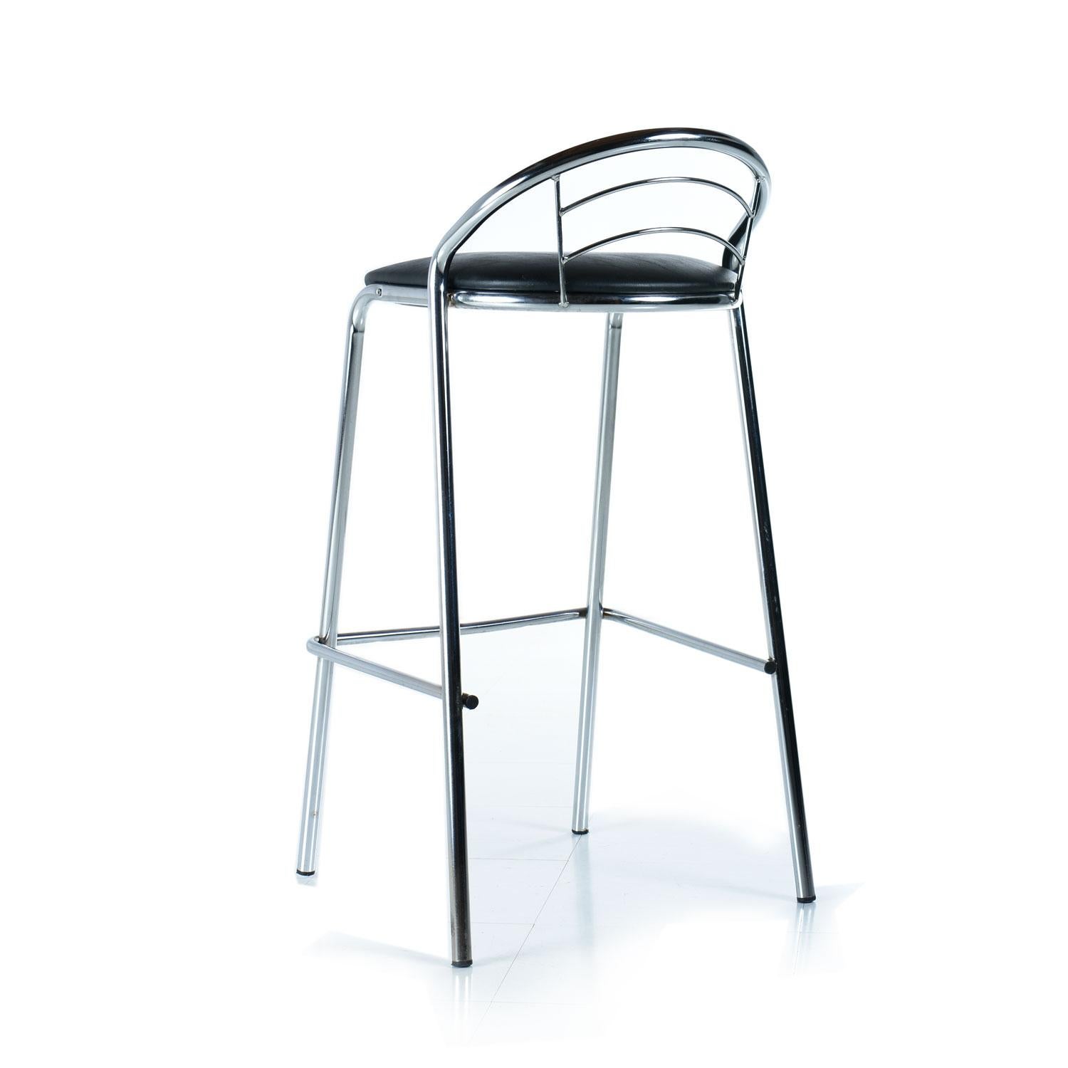 This handsome set of four modern chrome bar stools were made in Brazil. The tubular chrome frames are super stylish and can blend with contemporary or Mid-Century Modern decor. The black vinyl seats are durable and easy to maintain. Relax in the