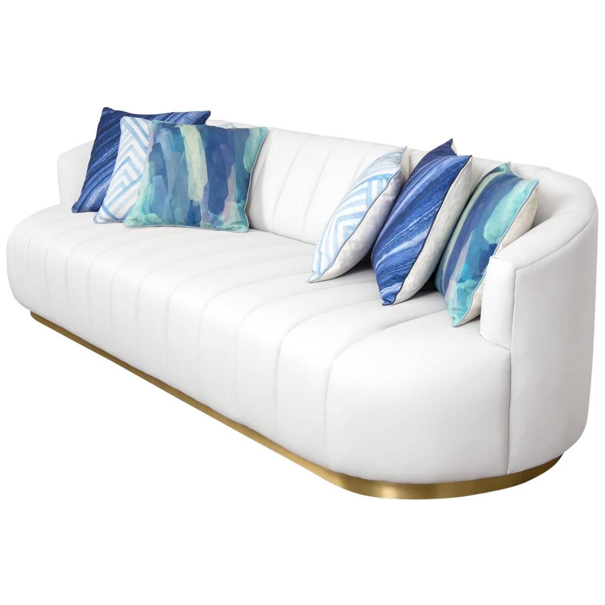 Modern Tufted Pearl White Faux Leather Sofa with Channel Tufting & Brass Toekick For Sale