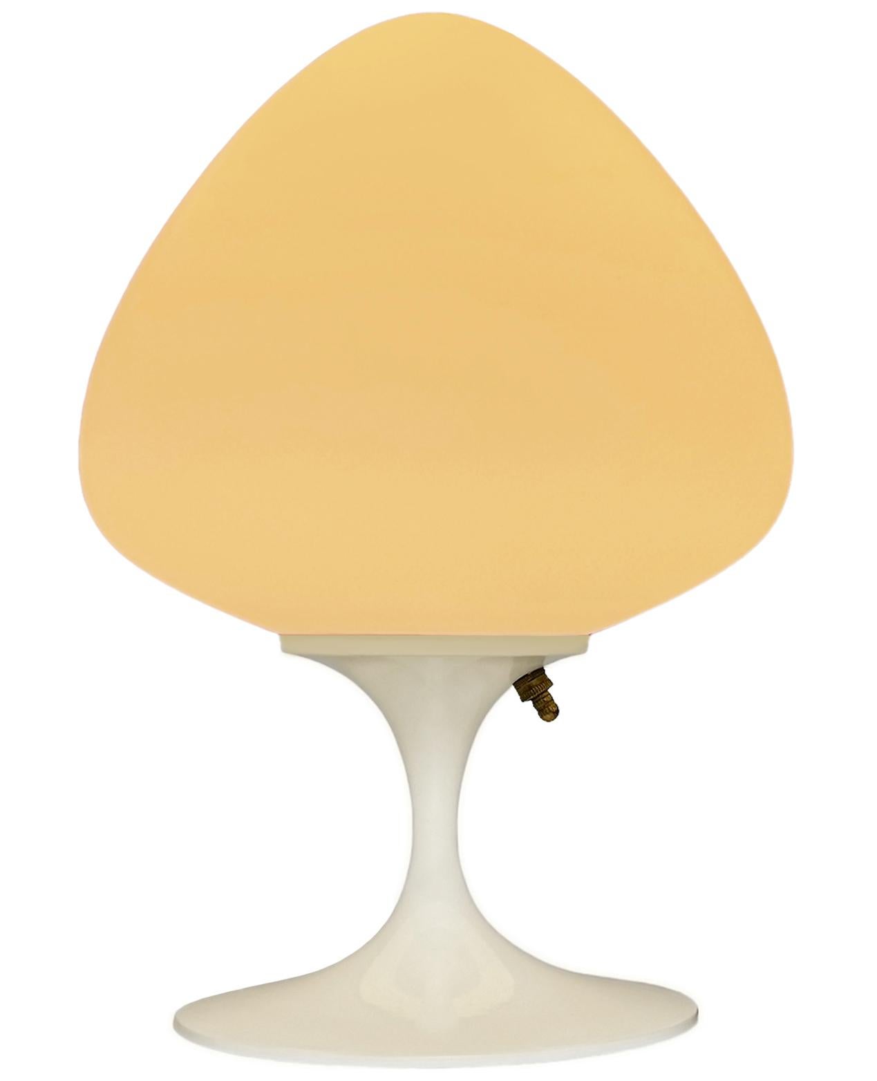 A gorgeous tulip form table lamp, desk lamp or bedside lamp. It features a glossy white cast aluminum base with mouth blown frosted white glass shade in an acorn form. It takes one standard bulb up to 100 watts.

These retro lamps work with all