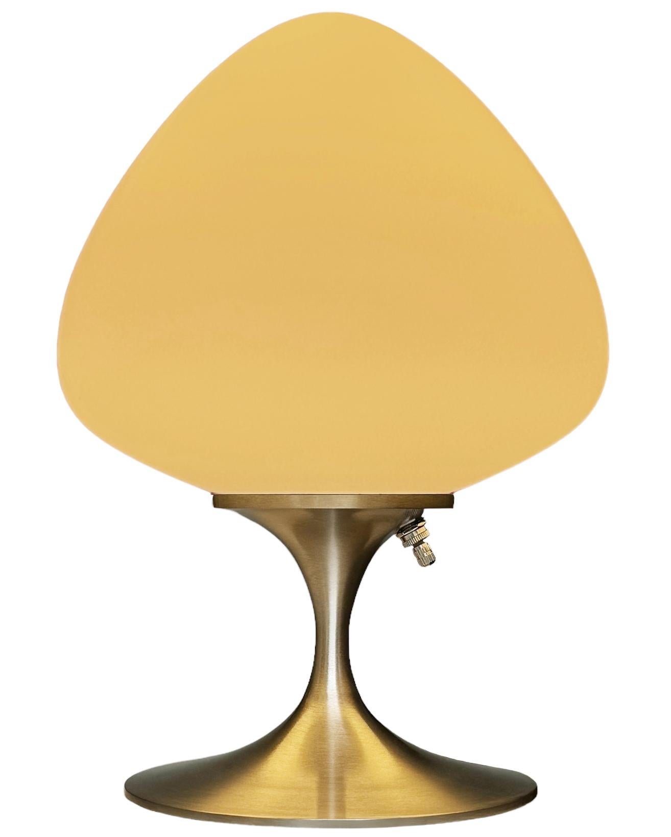 A gorgeous tulip form table lamp, desk lamp or bedside lamp. It features a brushed chrome cast aluminum base with mouth blown frosted white glass shade in an acorn form. It takes one standard bulb up to 100 watts.

These retro lamps work with all