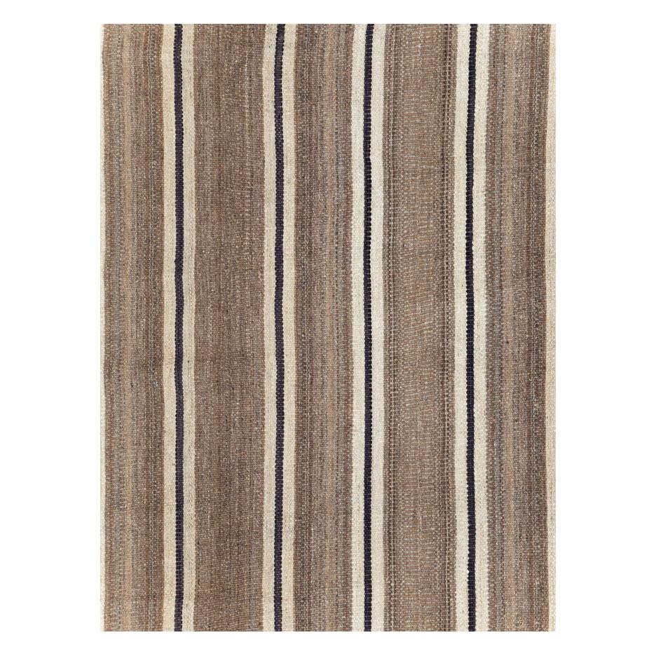 A modern Turkish flatweave Kilim small room size carpet handmade during the 21st century in shades of cream, black, and light brown.

Measures: 8' 3