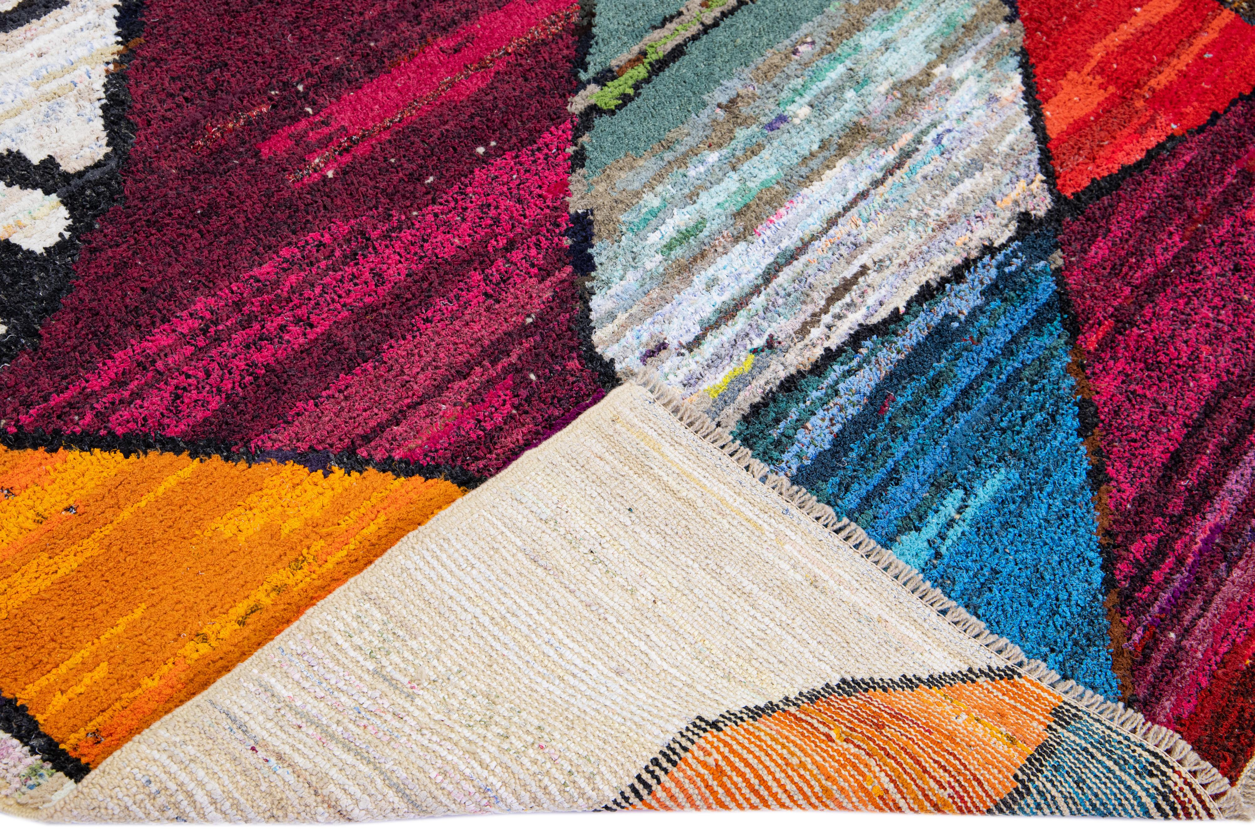 Beautiful Turkish handmade wool rug with a beige field. This Modern rug has multicolor accents featuring a gorgeous all-over expressionism design.

This rug measures: 8'3'' x 10'2