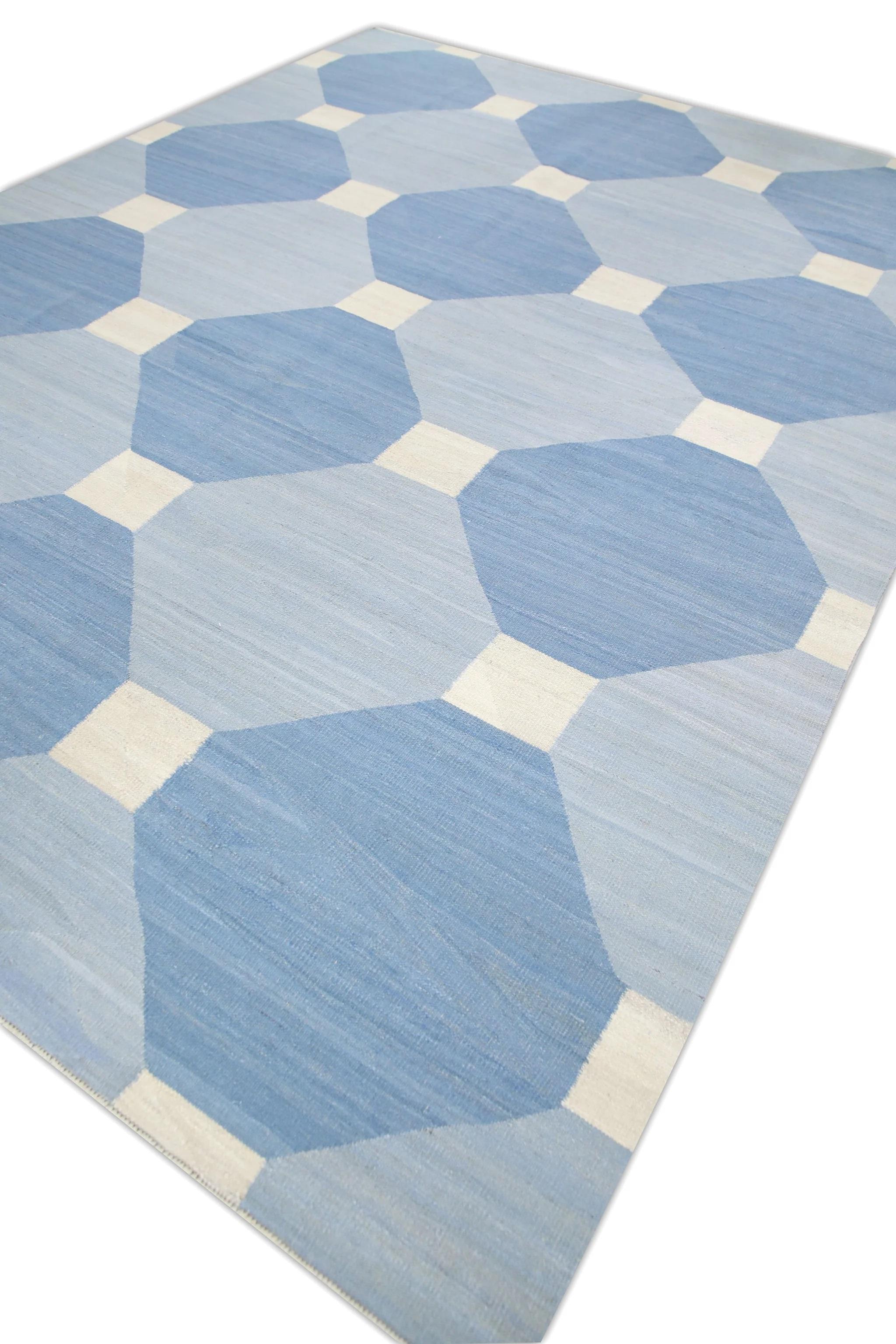 This exquisite Modern Turkish Kilim rug is a stunning masterpiece of traditional craftsmanship. Each rug is meticulously handwoven by skilled artisans using age-old techniques passed down through generations. The intricate design features a