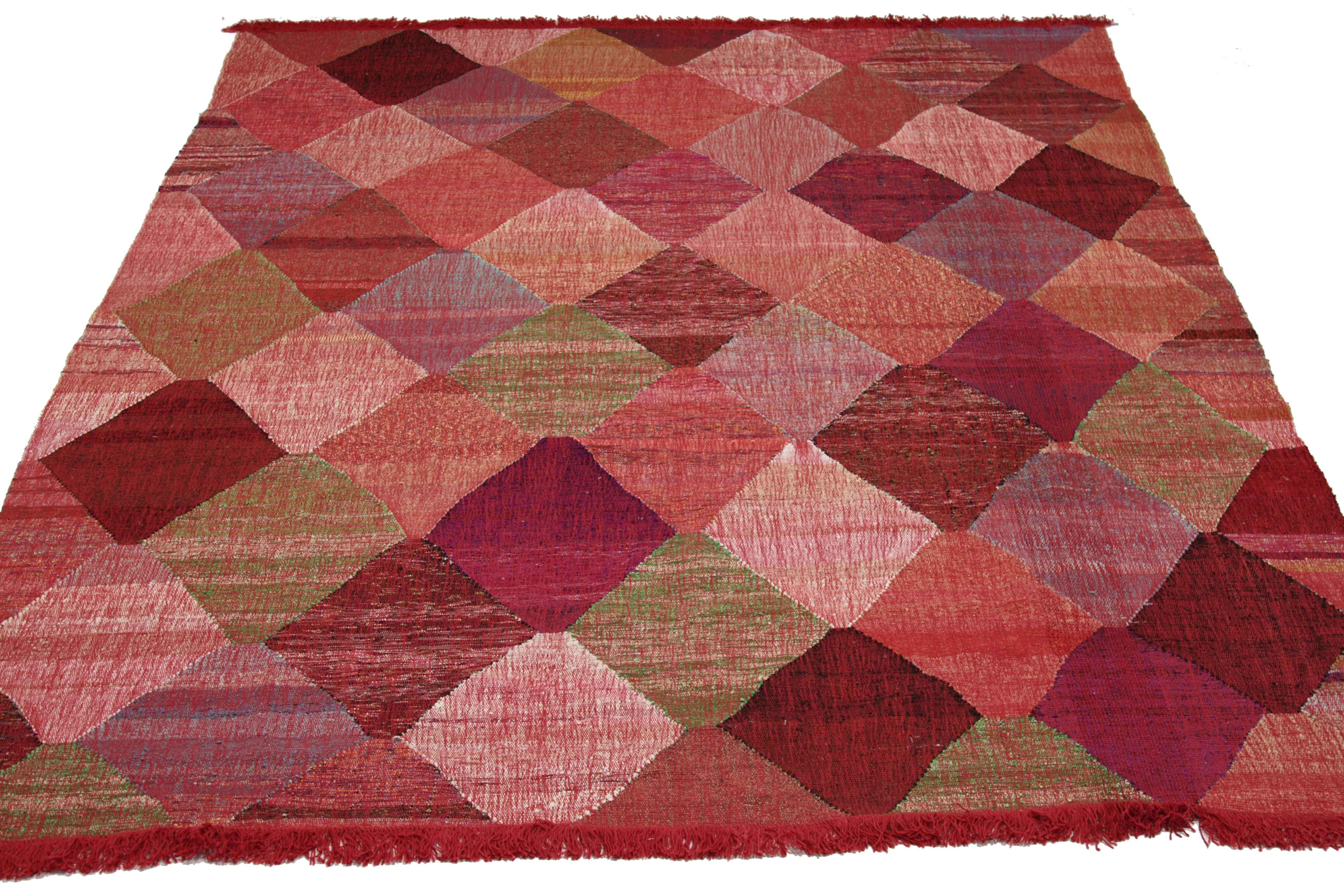New Turkish rug handwoven from wool taken from antique fine carpets. It’s a traditional Kilim weaving featuring diamond patterns in vibrant colors over an ivory field. It’s a stunning piece to get for contemporary and modern spaces. It has a