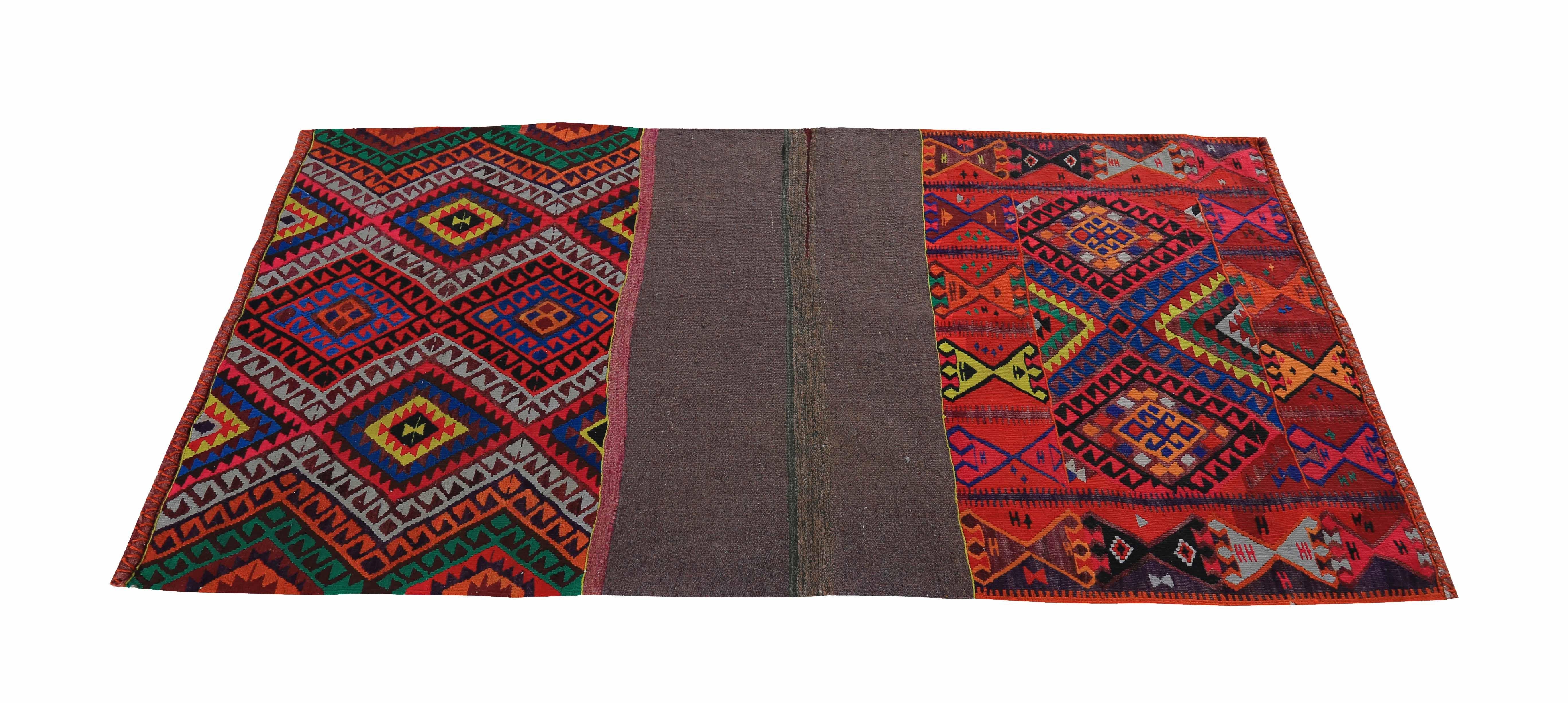 Modern Turkish rug handwoven from the finest sheep’s wool and colored with all-natural vegetable dyes that are safe for humans and pets. It’s a traditional Kilim flat-weave design featuring colorful diamond patterns. It’s a stunning piece to get for