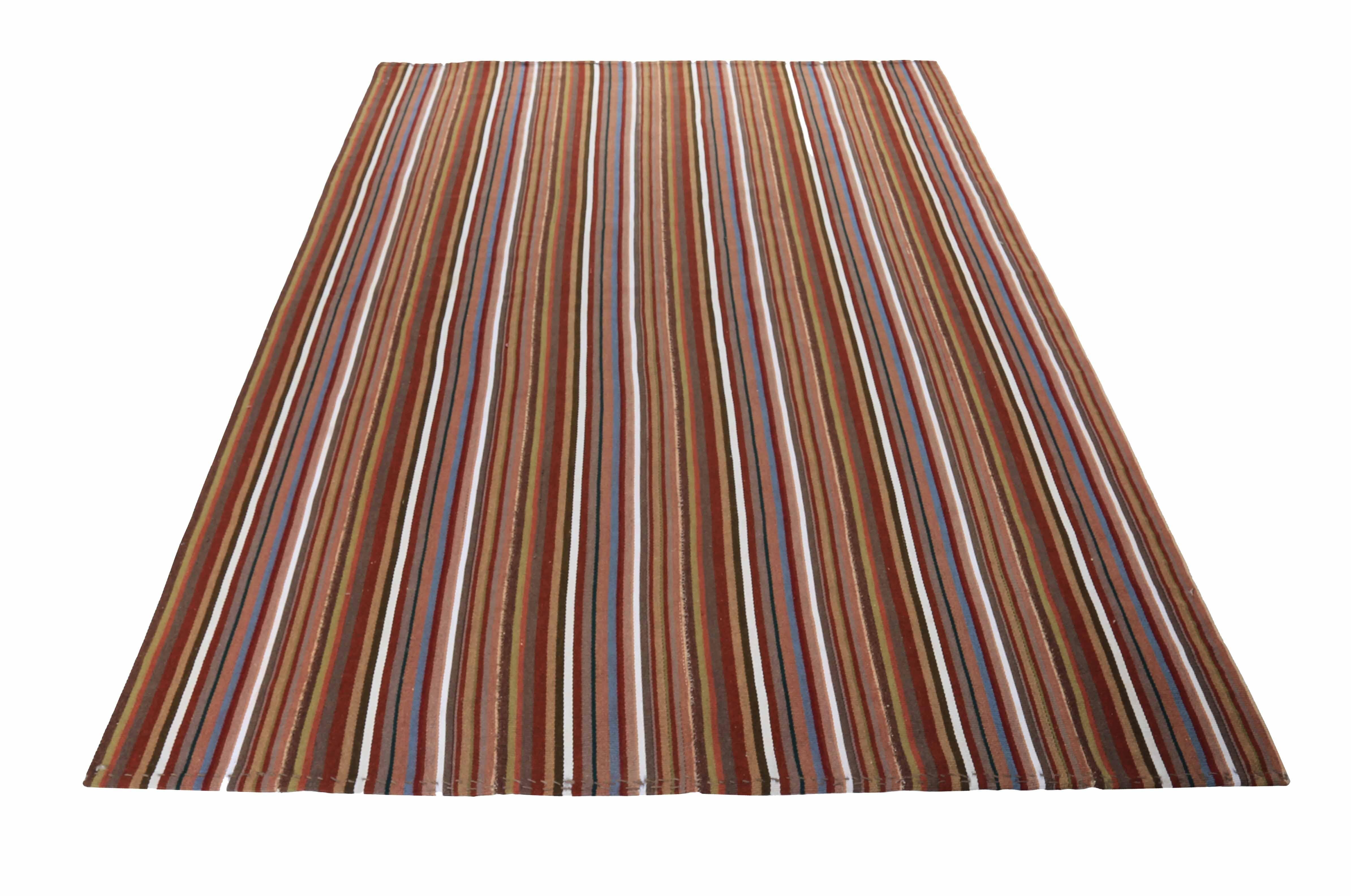 Modern Turkish rug handwoven from the finest sheep’s wool and colored with all-natural vegetable dyes that are safe for humans and pets. It’s a traditional Kilim flat-weave design featuring brown, gray, and white stripes. It’s a stunning piece to