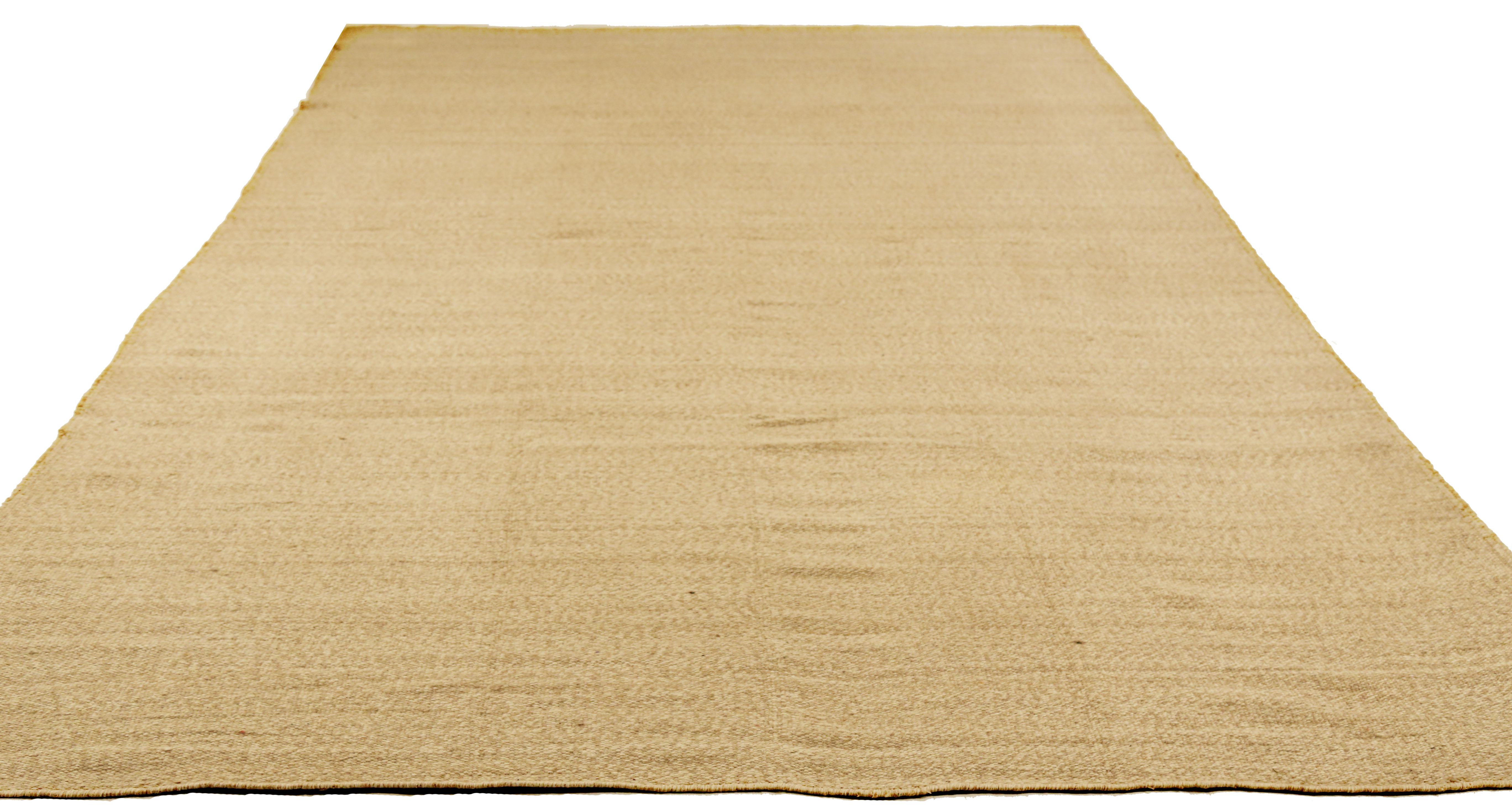 Modern Turkish rug handwoven from the finest sheep’s wool and colored with all-natural vegetable dyes that are safe for humans and pets. It’s a traditional Kilim flat-weave design featuring brown lines on an ivory field. It’s a stunning piece to get