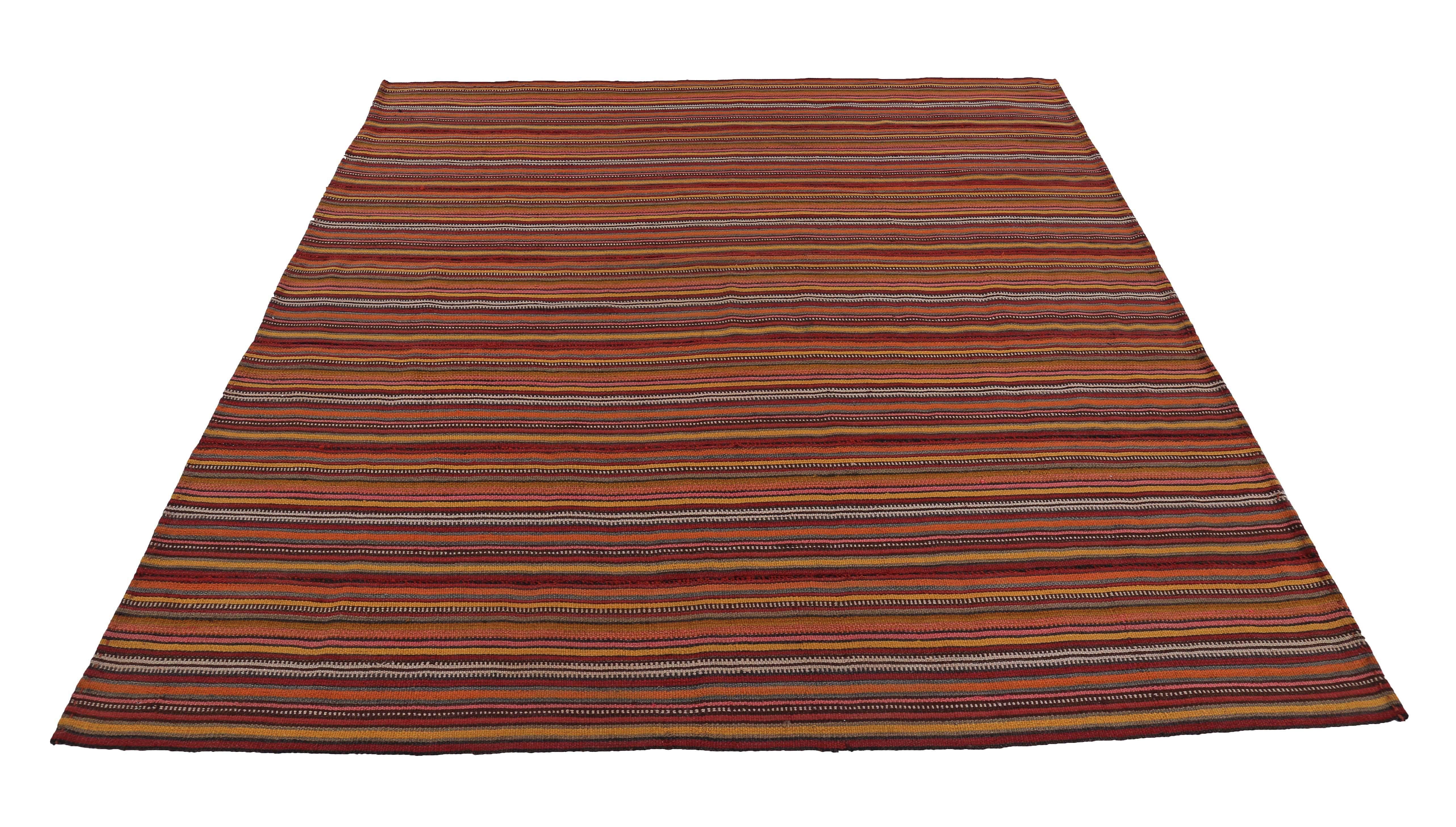 Turkish rug handwoven from the finest sheep’s wool and colored with all-natural vegetable dyes that are safe for humans and pets. It’s a traditional Kilim flat-weave design featuring orange, red and beige pencil stripes. It’s a stunning piece to get