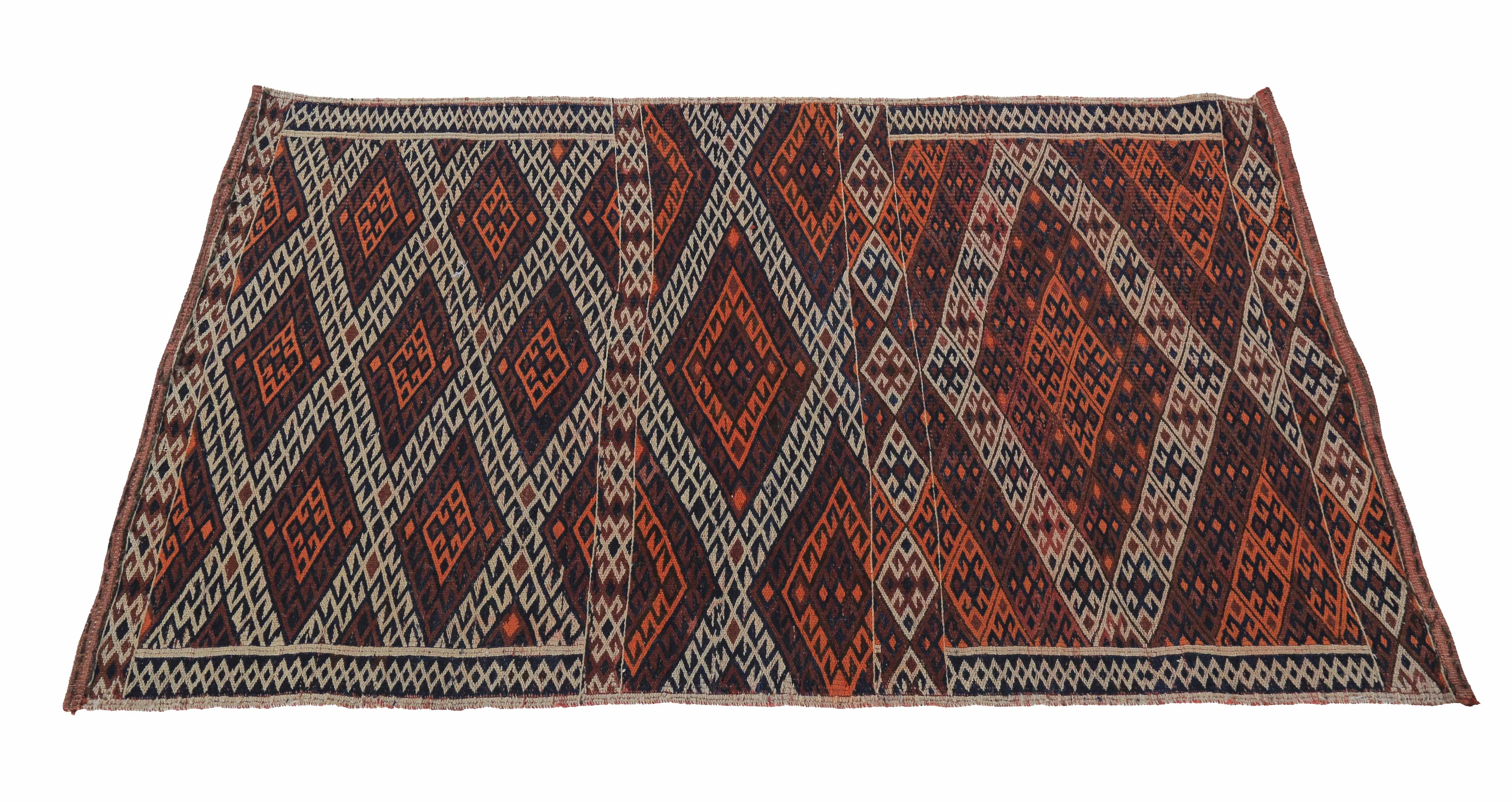 Modern Turkish rug handwoven from the finest sheep’s wool and colored with all-natural vegetable dyes that are safe for humans and pets. It’s a traditional Kilim flat-weave design featuring orange and white tribal diamonds. It’s a stunning piece to