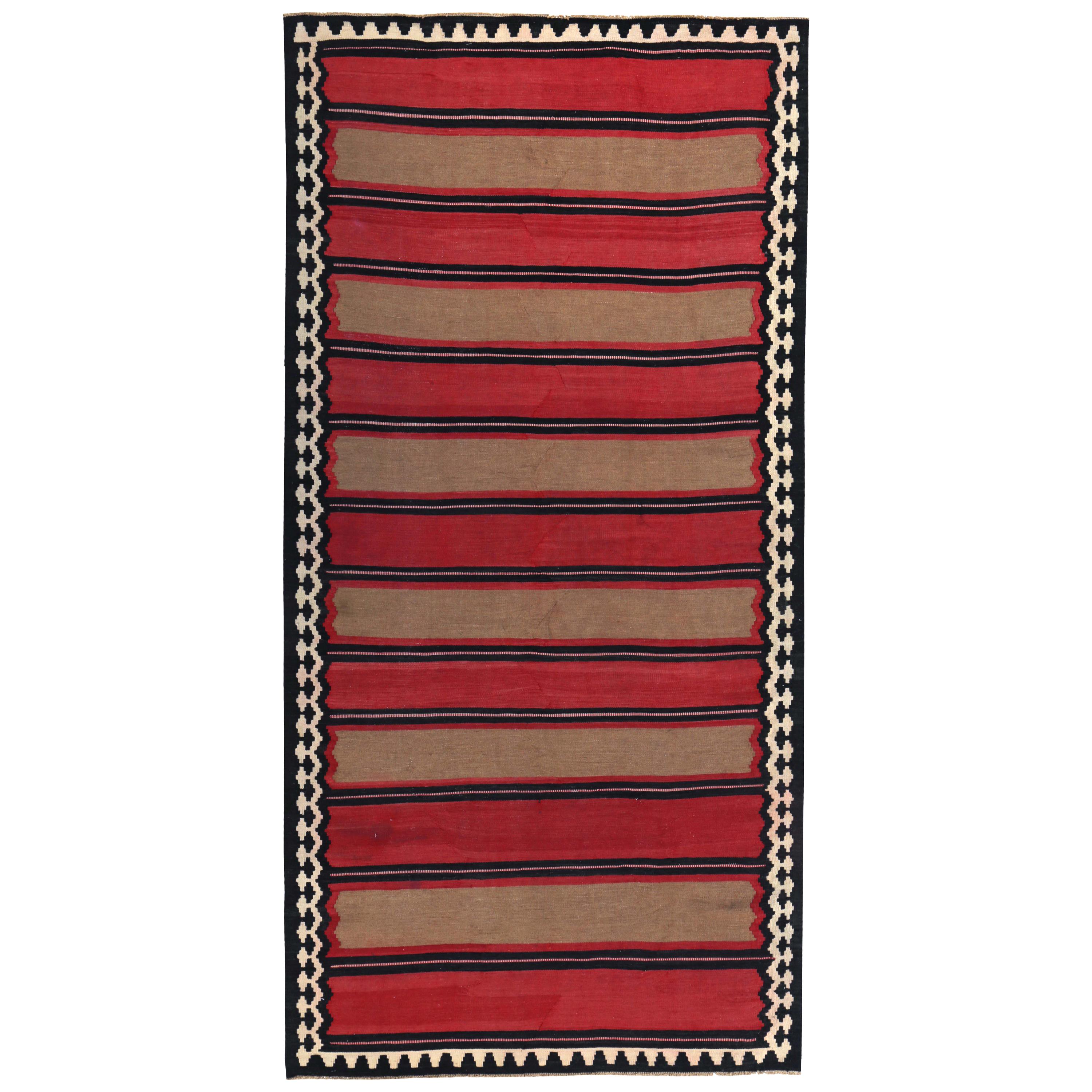 Modern Turkish Kilim Rug with Red and Brown and Block Stripes in a Black Field For Sale