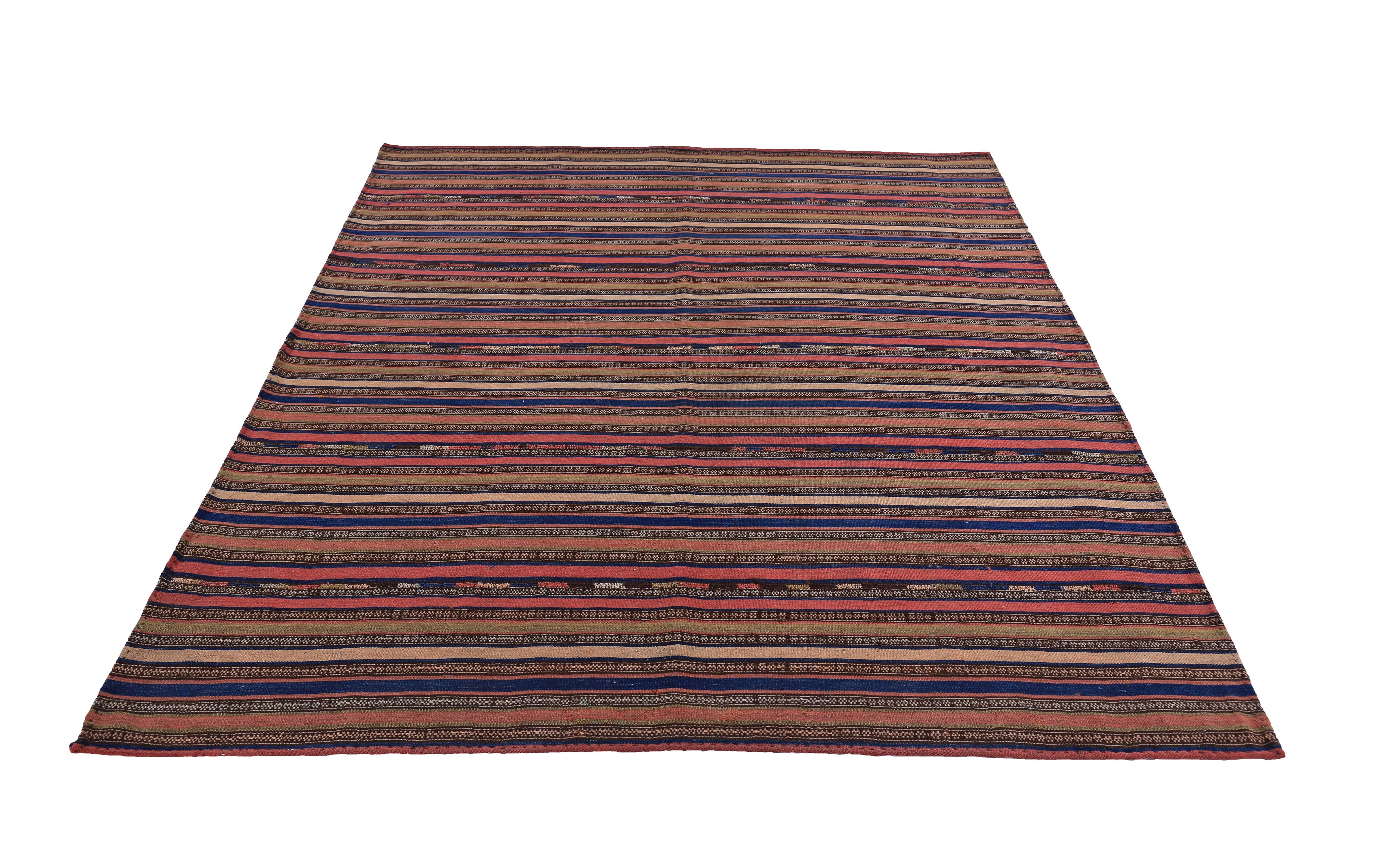 Modern Turkish rug handwoven from the finest sheep’s wool and colored with all-natural vegetable dyes that are safe for humans and pets. It’s a traditional Kilim flat-weave design featuring red, blue, brown and orange stripes. It’s a stunning piece