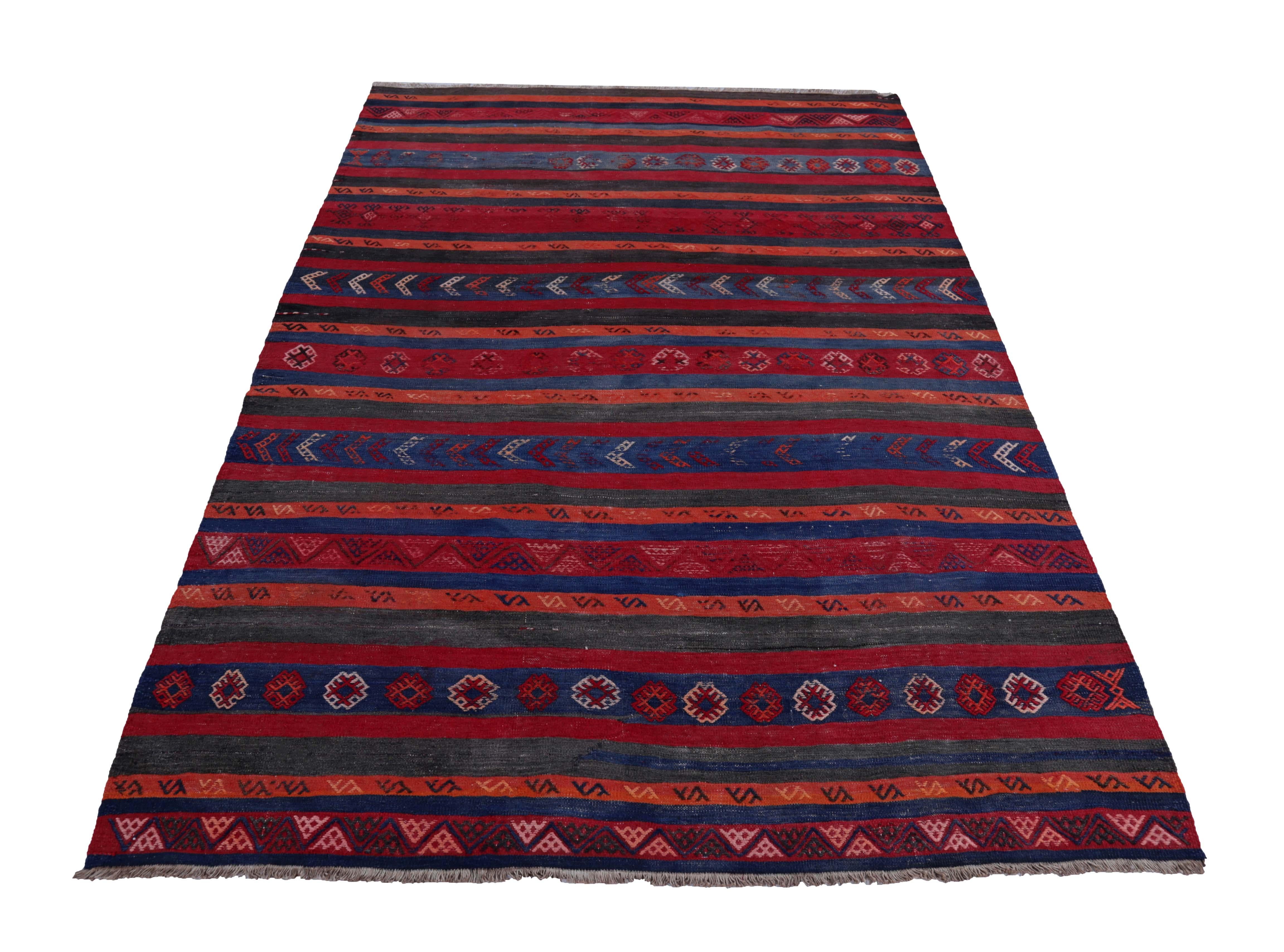 Turkish rug handwoven from the finest sheep’s wool and colored with all-natural vegetable dyes that are safe for humans and pets. It’s a traditional Kilim flat-weave design featuring red, blue and orange stripes with tribal design patterns. It’s a