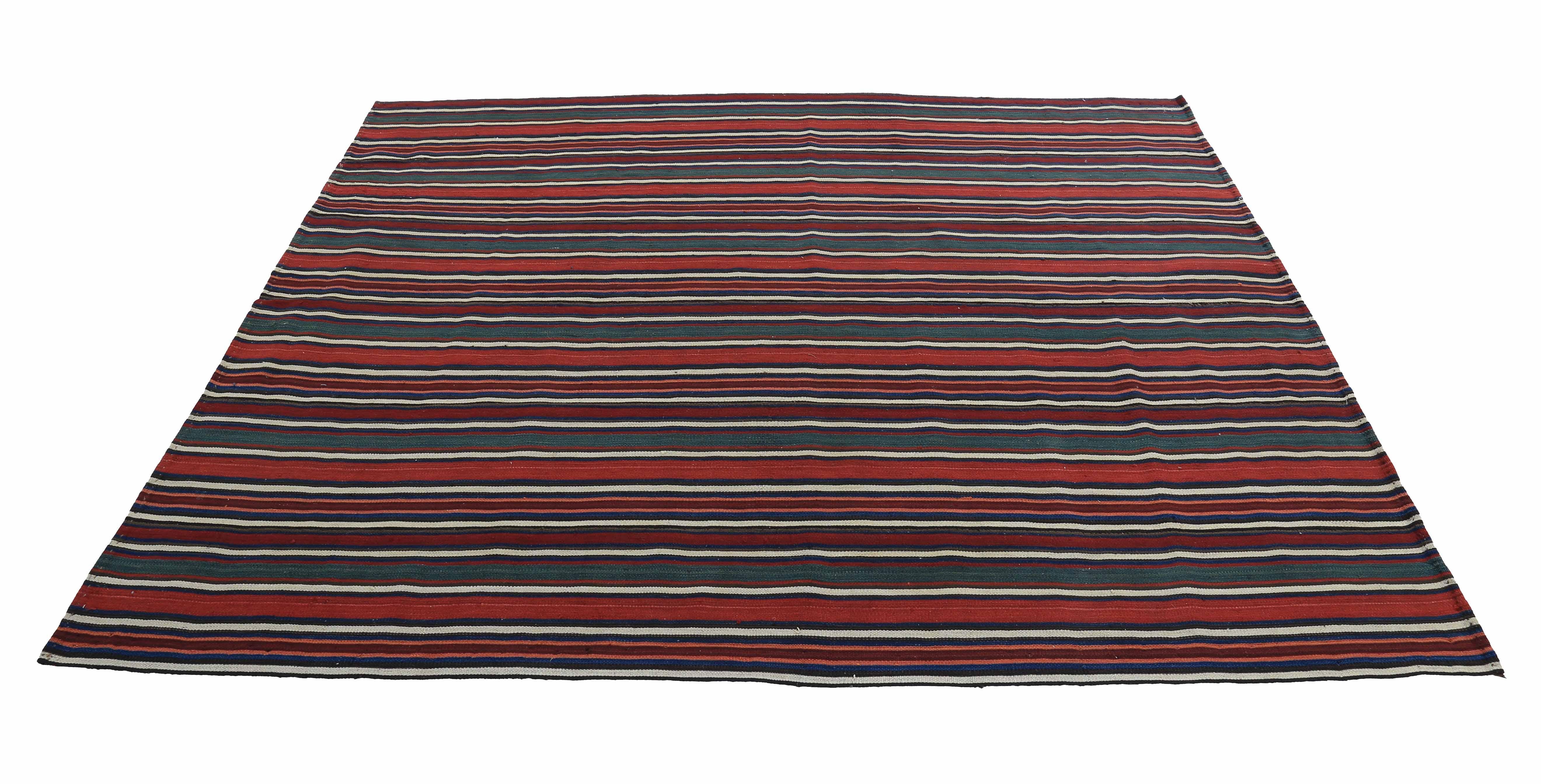 Modern Turkish rug handwoven from the finest sheep’s wool and colored with all-natural vegetable dyes that are safe for humans and pets. It’s a traditional Kilim flat-weave design featuring red, ivory and black stripes. It’s a stunning piece to get