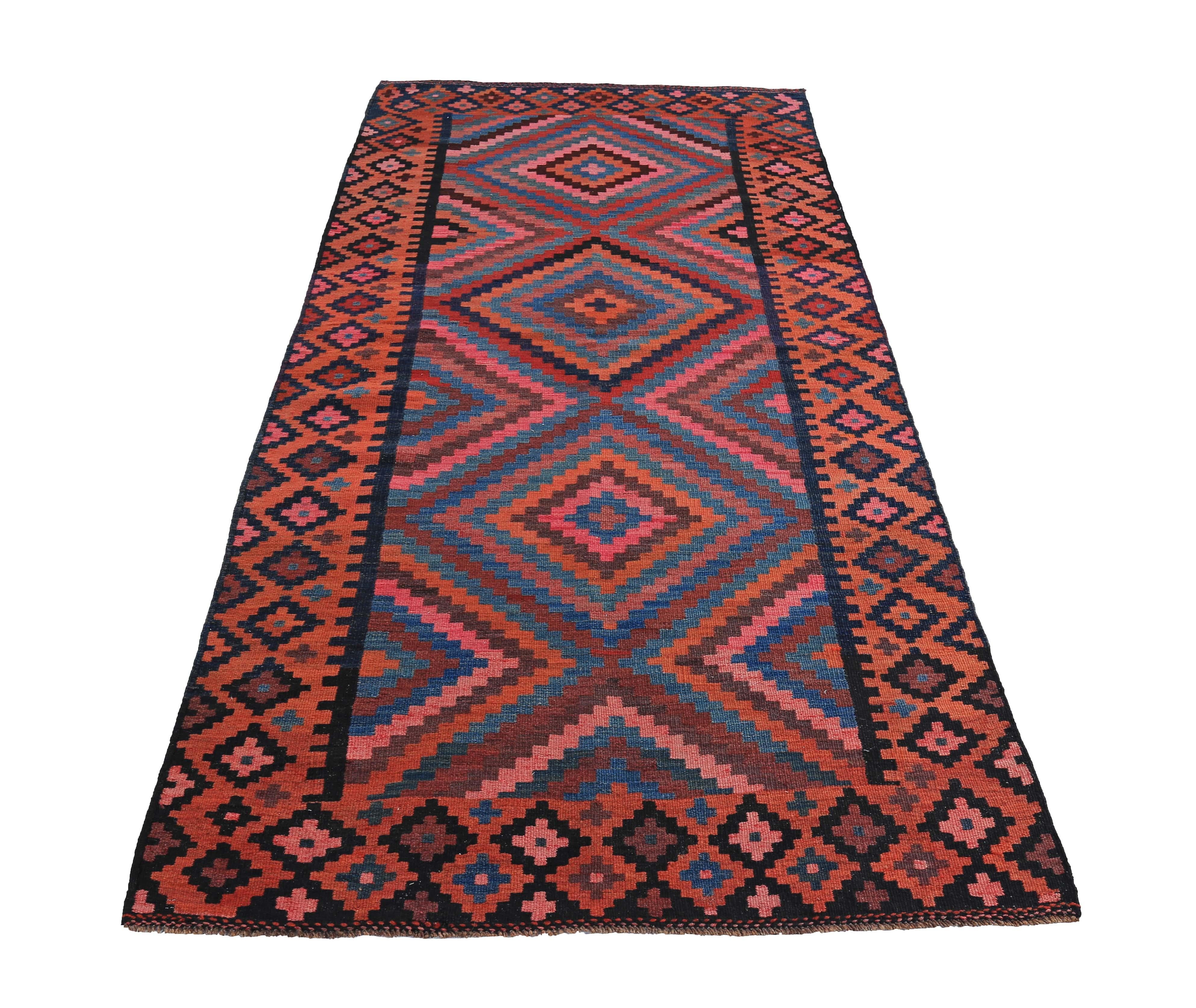 Turkish rug handwoven from the finest sheep’s wool and colored with all-natural vegetable dyes that are safe for humans and pets. It’s a traditional Kilim flat-weave design featuring red, pink and blue tribal design. It’s a stunning piece to get for