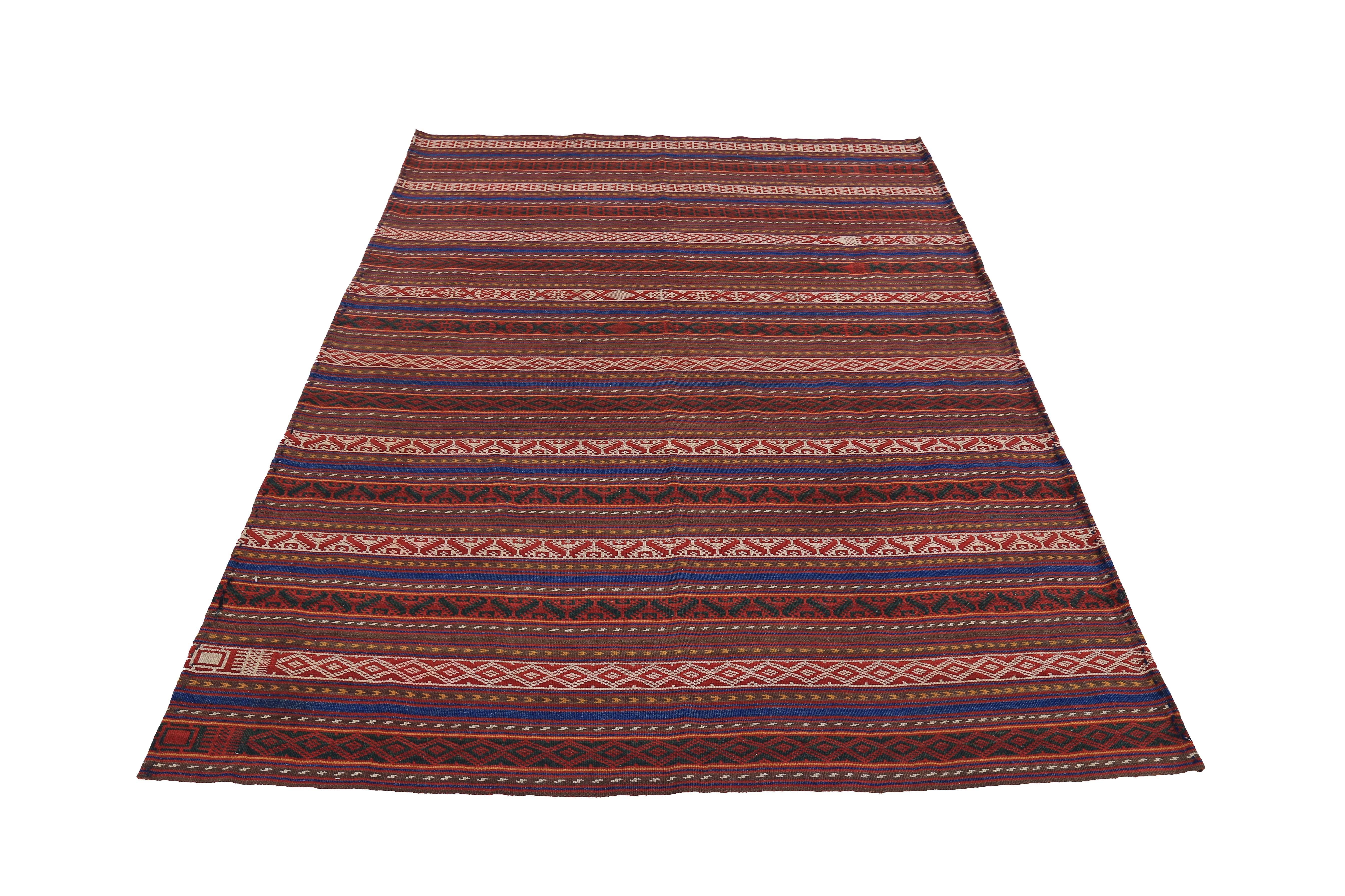 Turkish kilim rug handwoven from the finest sheep’s wool and colored with all-natural vegetable dyes that are safe for humans and pets. It’s a traditional Kilim flat-weave design featuring red, white and orange tribal stripes on a brown field. It’s