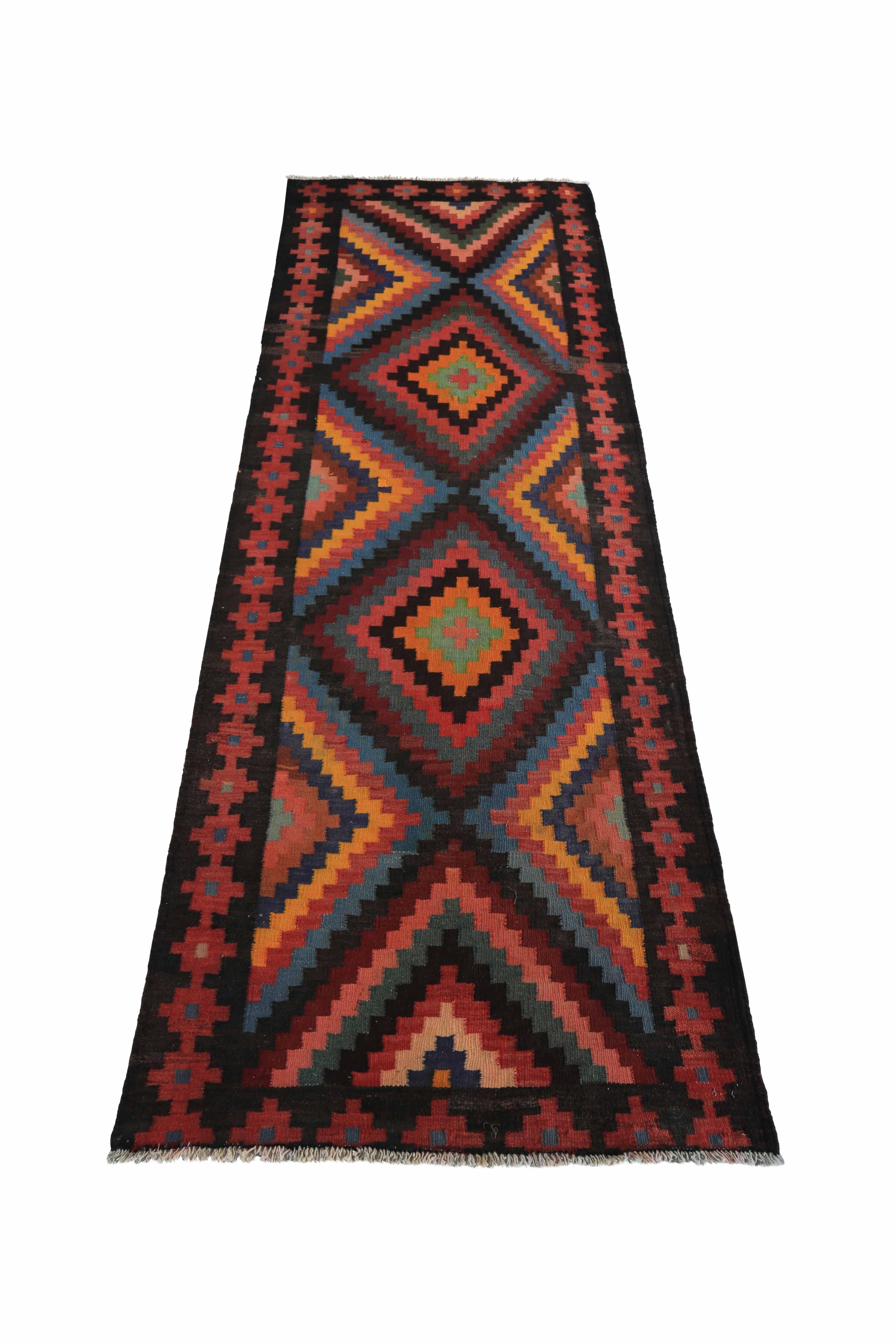 Modern Turkish rug handwoven from the finest sheep’s wool and colored with all-natural vegetable dyes that are safe for humans and pets. It’s a traditional Kilim flat-weave design featuring colorful diamond patterns. It’s a stunning piece to get for