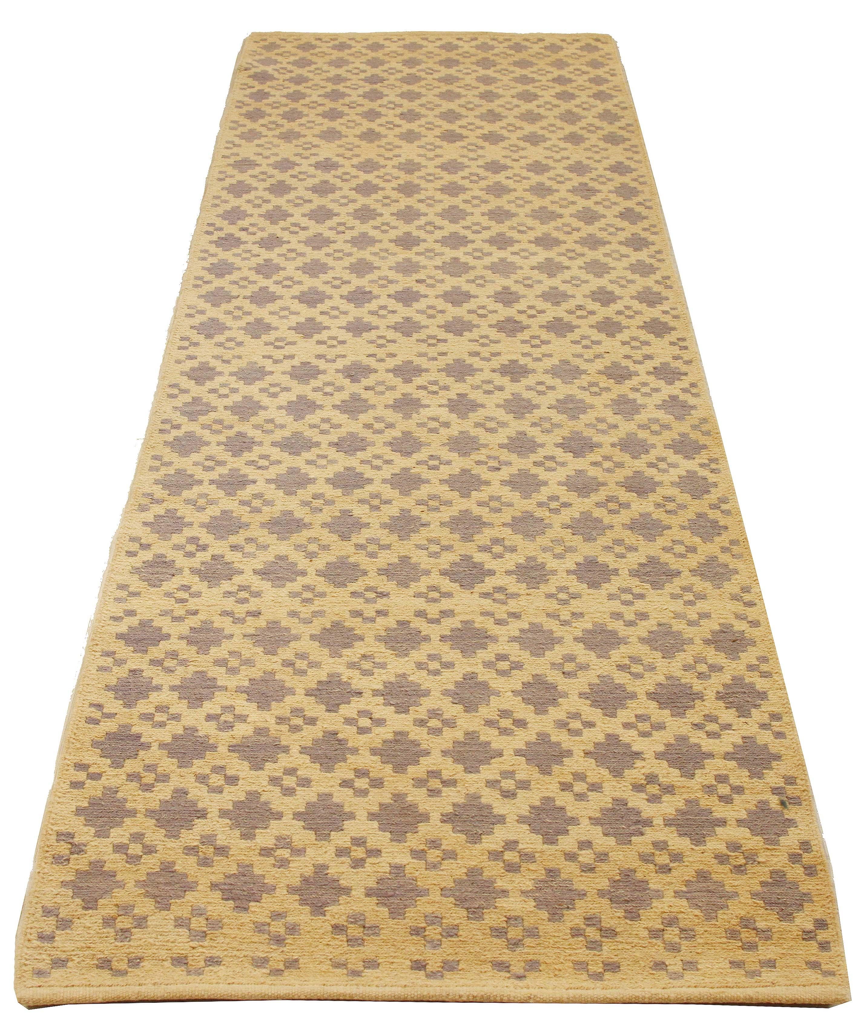 Turkish rug handwoven from the finest sheep’s wool and colored with all-natural vegetable dyes that are safe for humans and pets. It’s a traditional Kilim flat-weave design featuring geometric patterns of gray on a plush beige field. It’s a stunning
