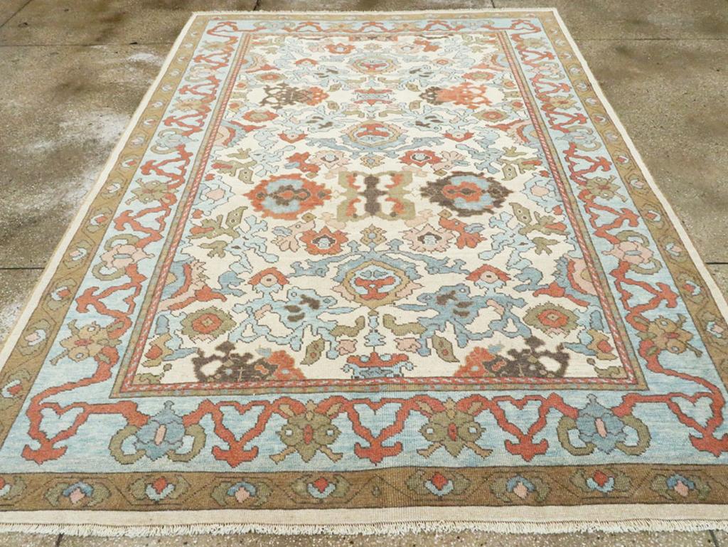 This exquisite 21st-century Turkish Oushak rug, measuring 7' 1